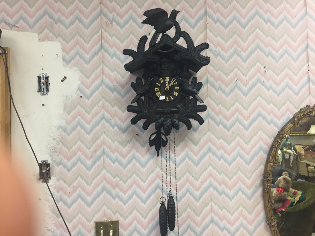 Black Eagle Cuckoo Clock: Black Eagle Cuckoo Clock. We have the clock running now. Cuckoo always comes out. The only problems I see is where the bird has been repaired several times attaching it to the clock. Other than that,