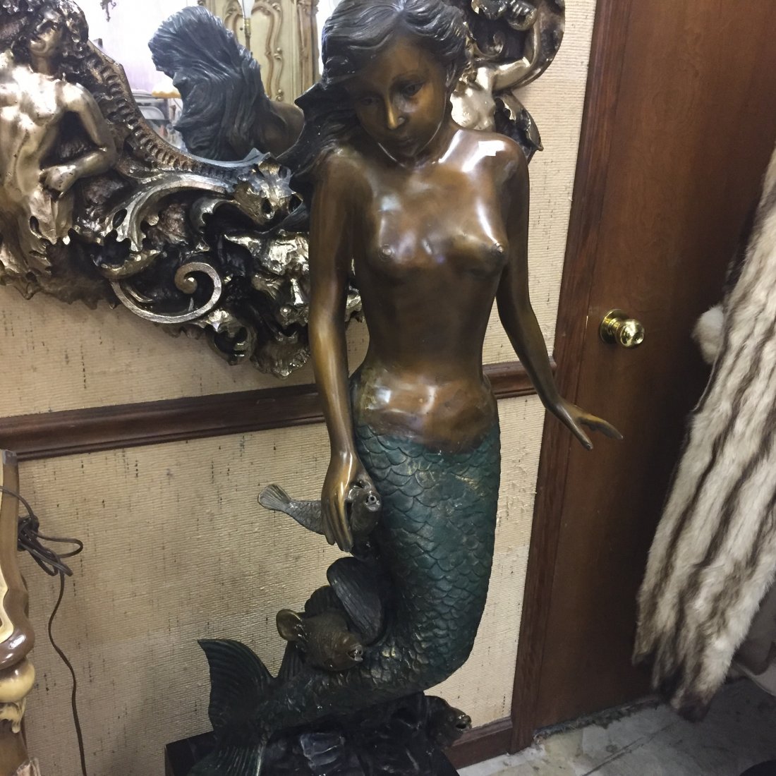 Bronze Mermaid Fountain: Bronze Cold Painted Mermaid Fountain, 42h x 22dia. on Base 14h x 20sq. Water sprays out of the mouth of the 3-fish.