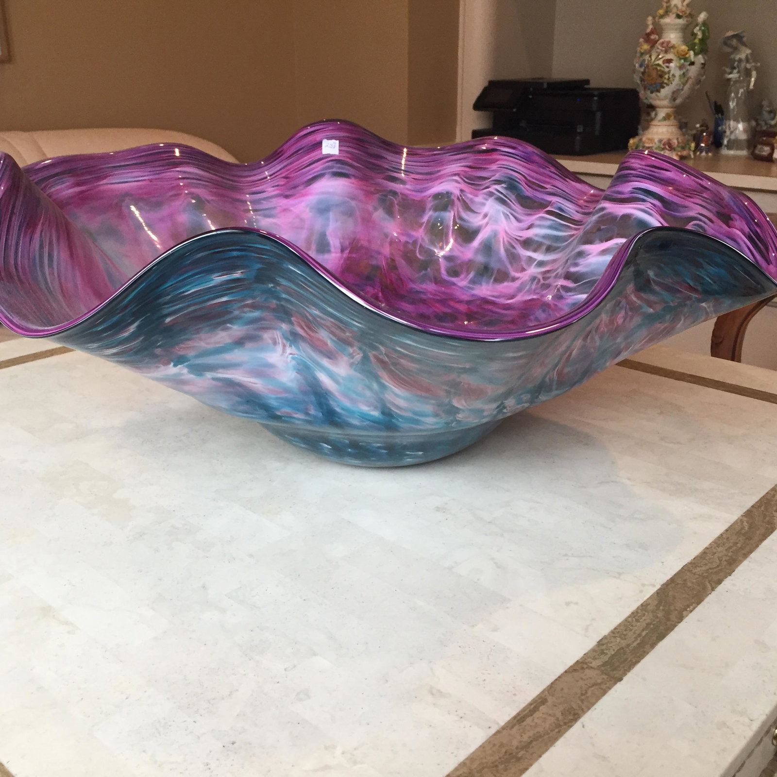 Gina Tona Art Glass Bowl 26" Manner of Chihuly: Artist signed blown glass bowl. Possibly from the Pilchuck glass in the manner of Dale Chihuly. Features a swirl of turquoise & amethyst colored glass in an ovular freeform shape. Signed on base. Meas