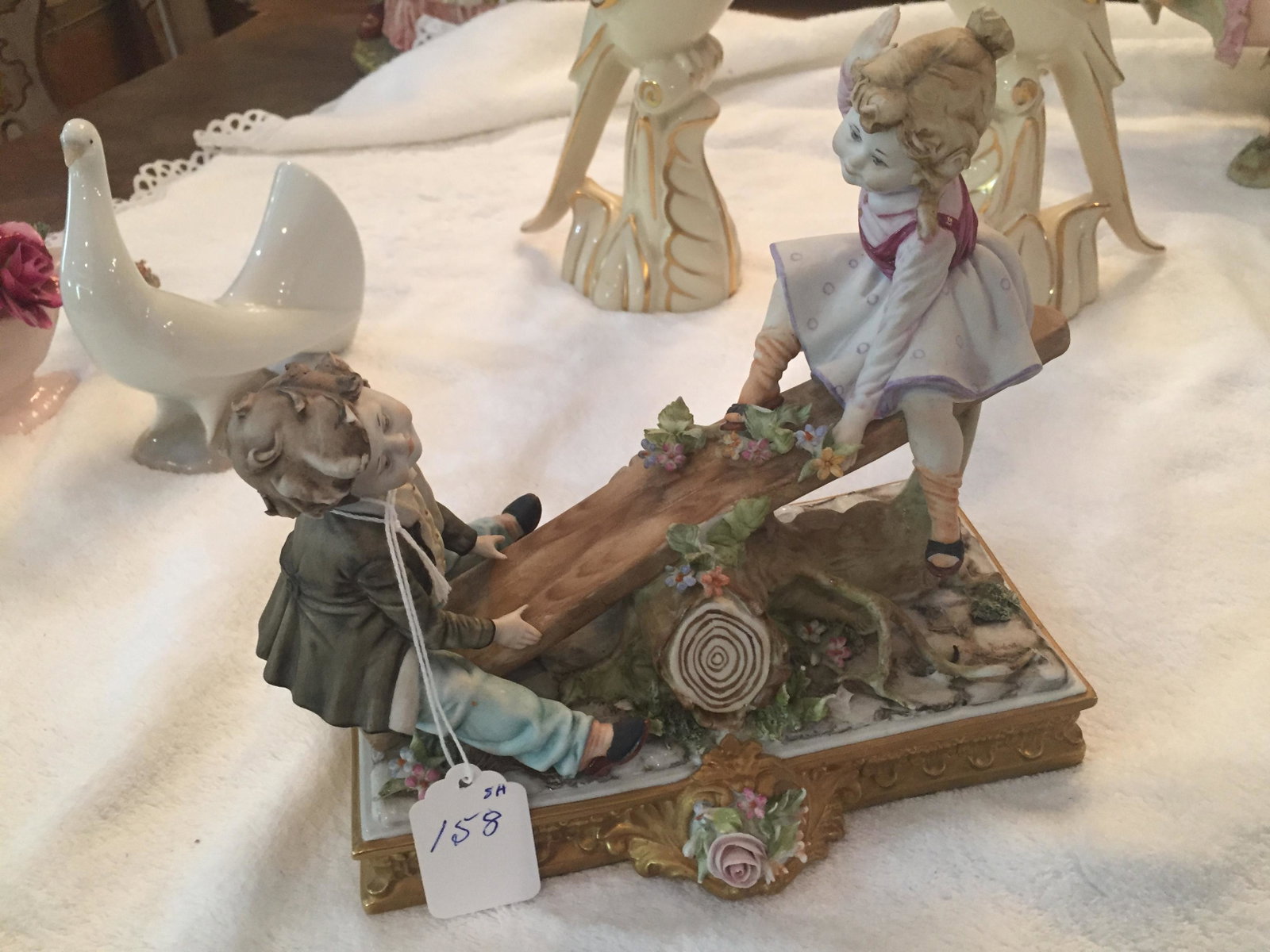 Capodimonte Boy & Girl: Capodimonte Bisque Figurine 'Boy & Girl on a Seesaw (also known as a teeter-totter) 8h x 8.5w 4d