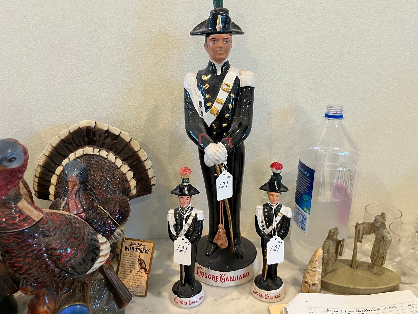 Liquore Galliano Soldier Decanters (3): (3) Vintage Liquore Galliano Soldier Decanters Figurine Coronetti Cunardo Italy 1969. The decanters are soldier figure dressed in black with gold accents, holding a sword and wearing a black hat. The 