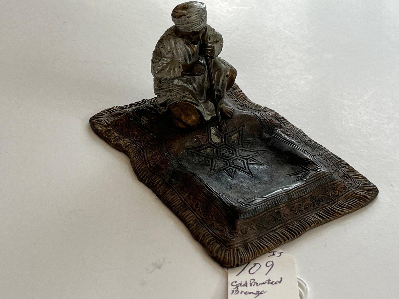 Ababic Musican on Carpet: Antique in the manner of Bergman Cold Painted Bronze Arabic Musican on a Carpet used as an ashtray