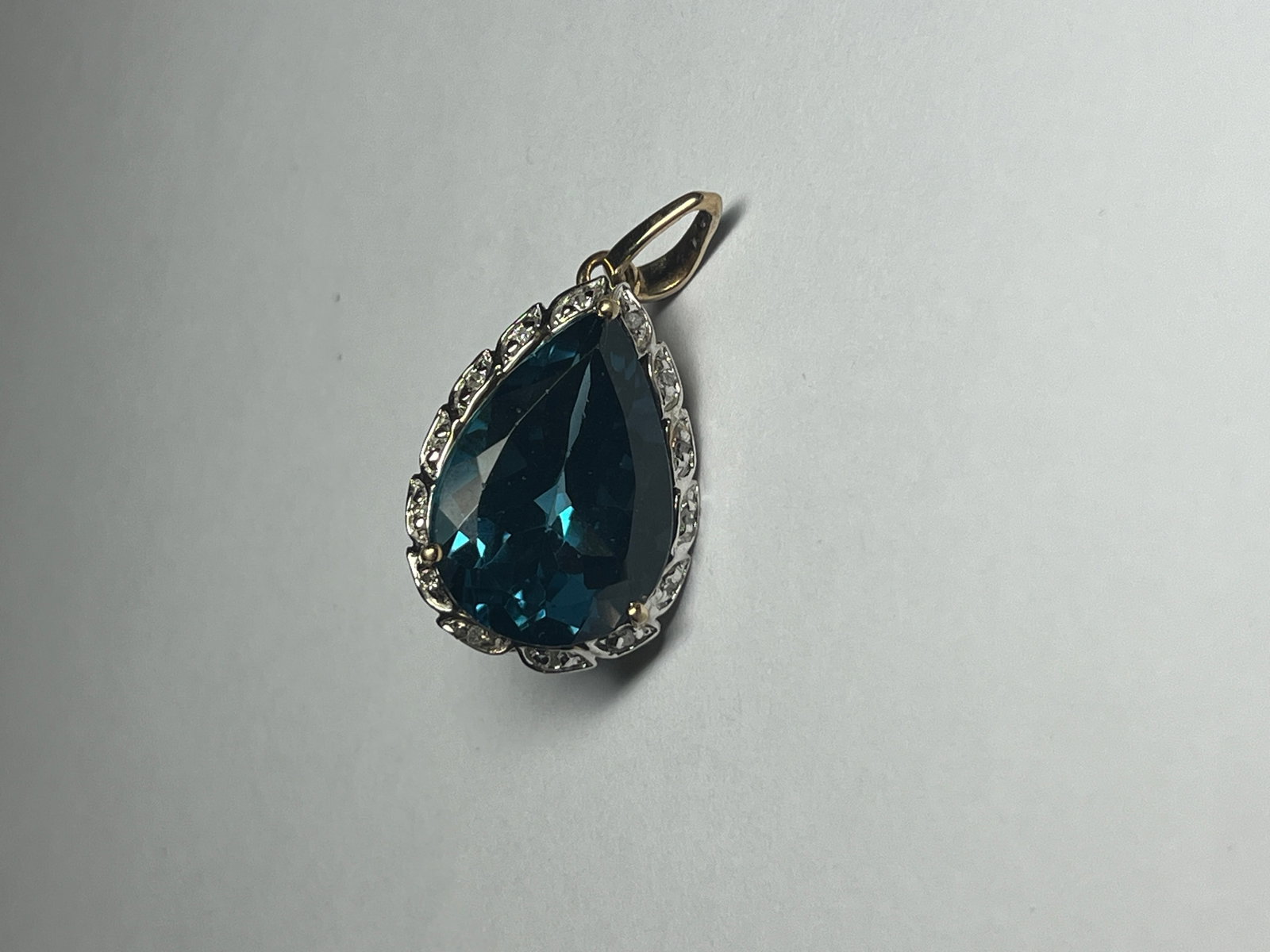 BL Topaz/Dia. Pendant: Brazilian London Blue Topaz Average 11.50ct Pear Shape with Diamond .10TW Round 10k YG Pendant, twt.4.2g