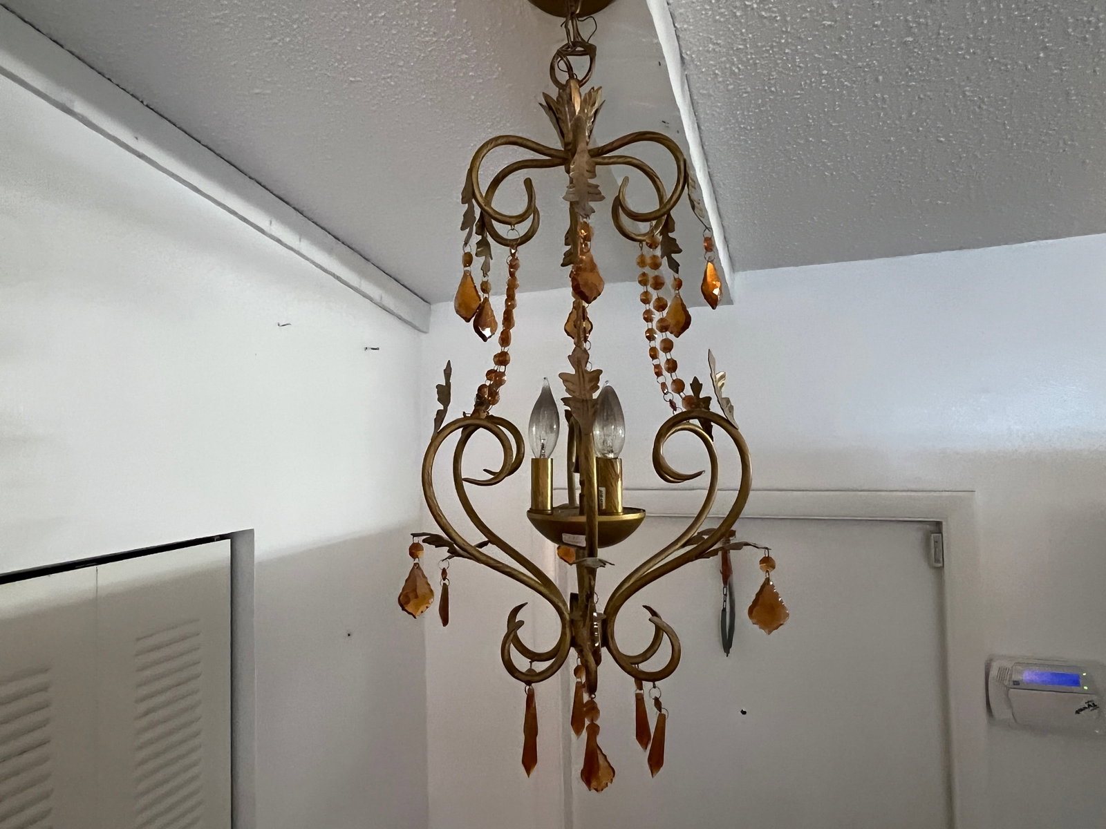 Gold Metal Hanging Amber Crystal Light: Mid to Early Century Gold Metal Frame Hanging Light with Amber Crystal