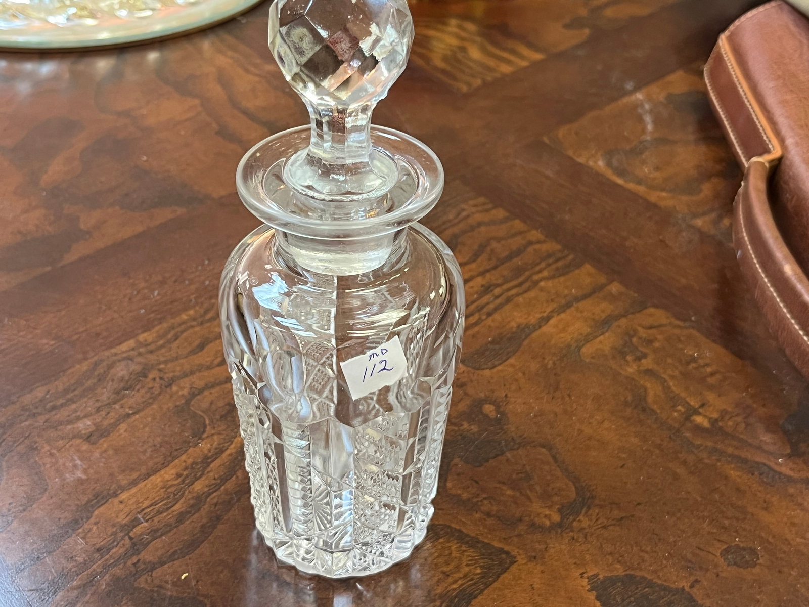 Cut Crystal 7.5"h Decanter: Cut Crystal 7.5"h Decanter (has sm. chip on bottom of stopper)