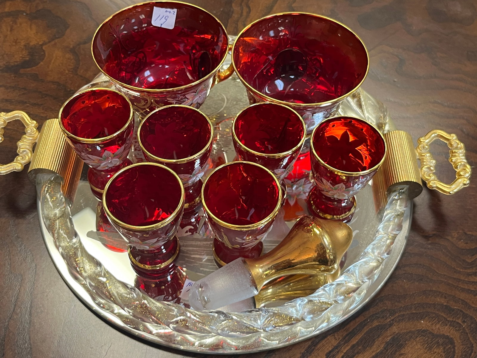 Several Venetian Ruby Red Cordial along with a Mary Gregory Style Mirred Dresser Tray with a Twisted: Several Venetian Ruby Red Cordial along with a Mary Gregory Style Mirred Dresser Tray with a Twisted Crystal Rim Filled withf Gold Specks.