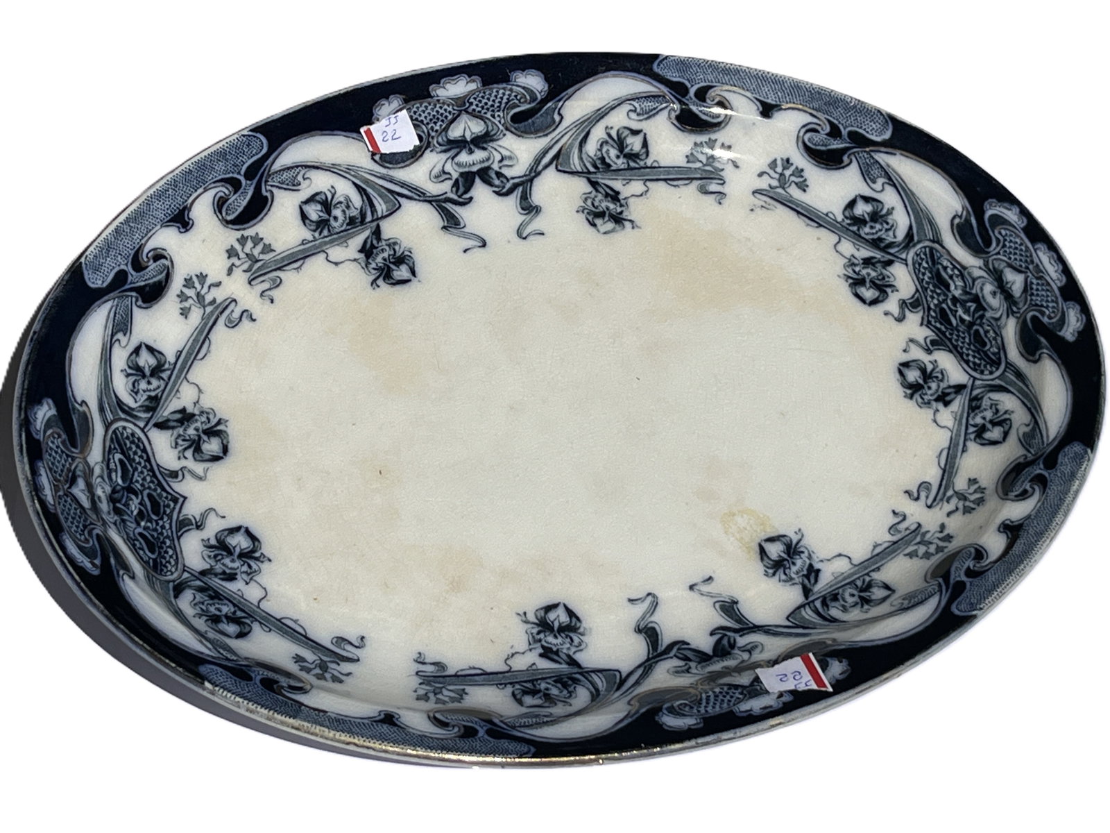 Blue & White Staffordshire “Iris” Transferware Platter, 13 x 9.5 in.: Antique blue and white Staffordshire transferware platter in the “Iris” pattern. Rectangular oval form decorated with floral and foliate motifs in rich cobalt transfer decoration