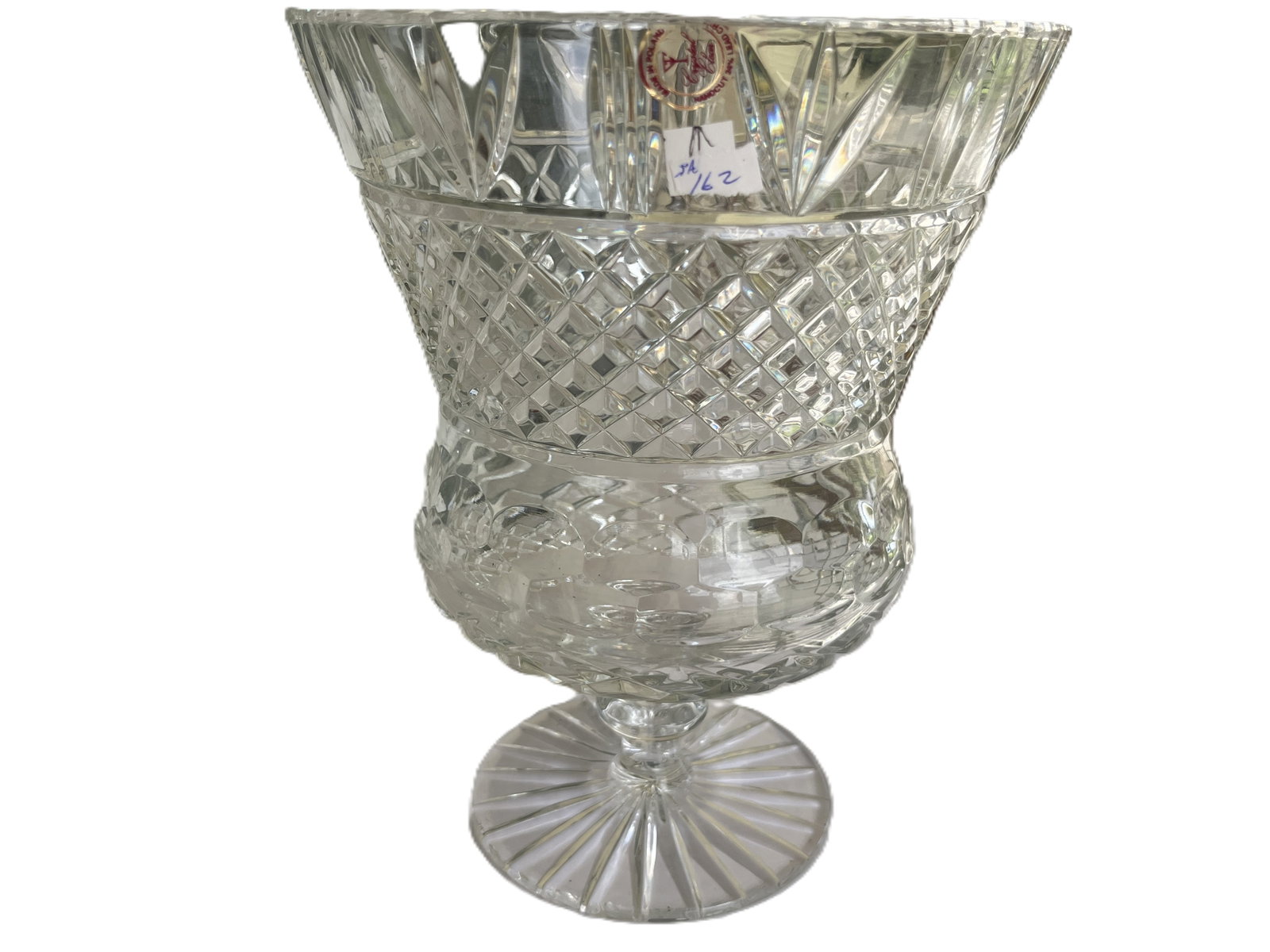 Crystal Clear Polish Hand-Cut Lead Crystal Vase, 10"h x 7.75"dia.: A striking Polish hand-cut lead crystal vase by Crystal Clear, featuring a flared rim with elongated leaf cuts, a diamond lattice midsection, and a faceted lower body on a radiating foot. The piece ex