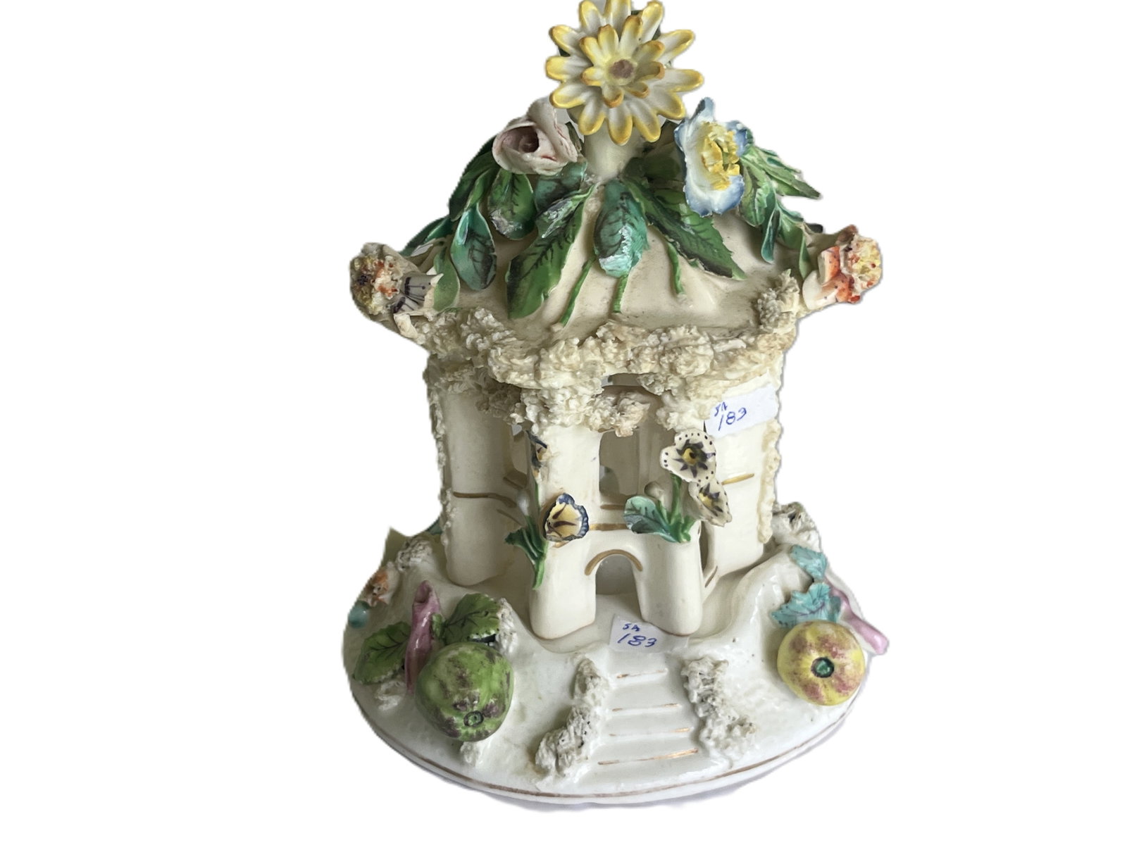 Antique Porcelain Floral Cottage Pastille Burner (c.1840-1860): A charming hand‑modeled porcelain cottage pastille burner featuring a hexagonal base with arched windows and a removable lid adorned with sculpted flowers and foliage. The piece is richly detail