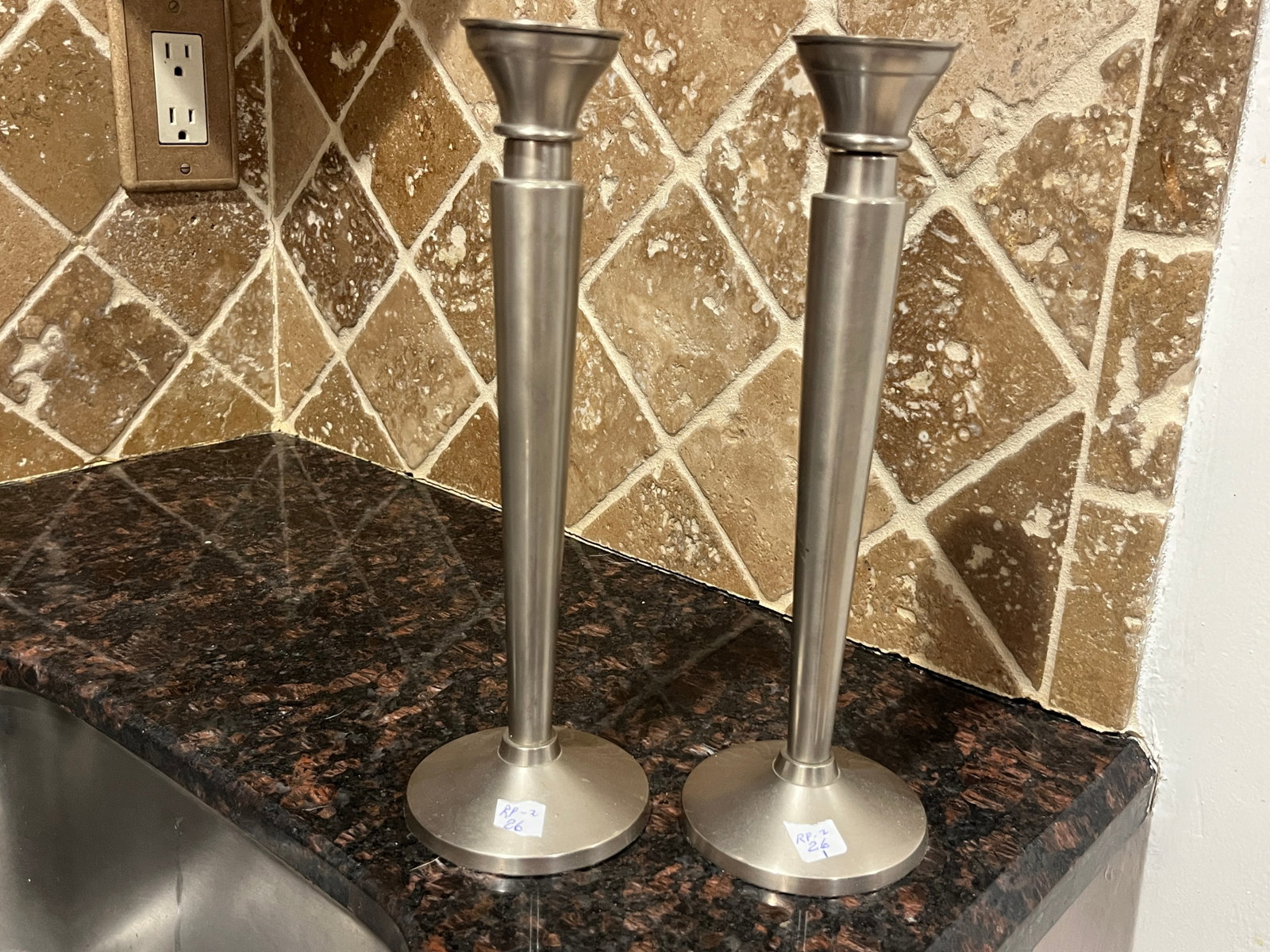 Pair of Contemporary Pewter Candlesticks, Satin Finish, 11"H: Pair of contemporary pewter candlesticks featuring a clean, tapered column design with flared candle cups and round bases. Finished in a soft satin pewter tone, these candlesticks complement both trad