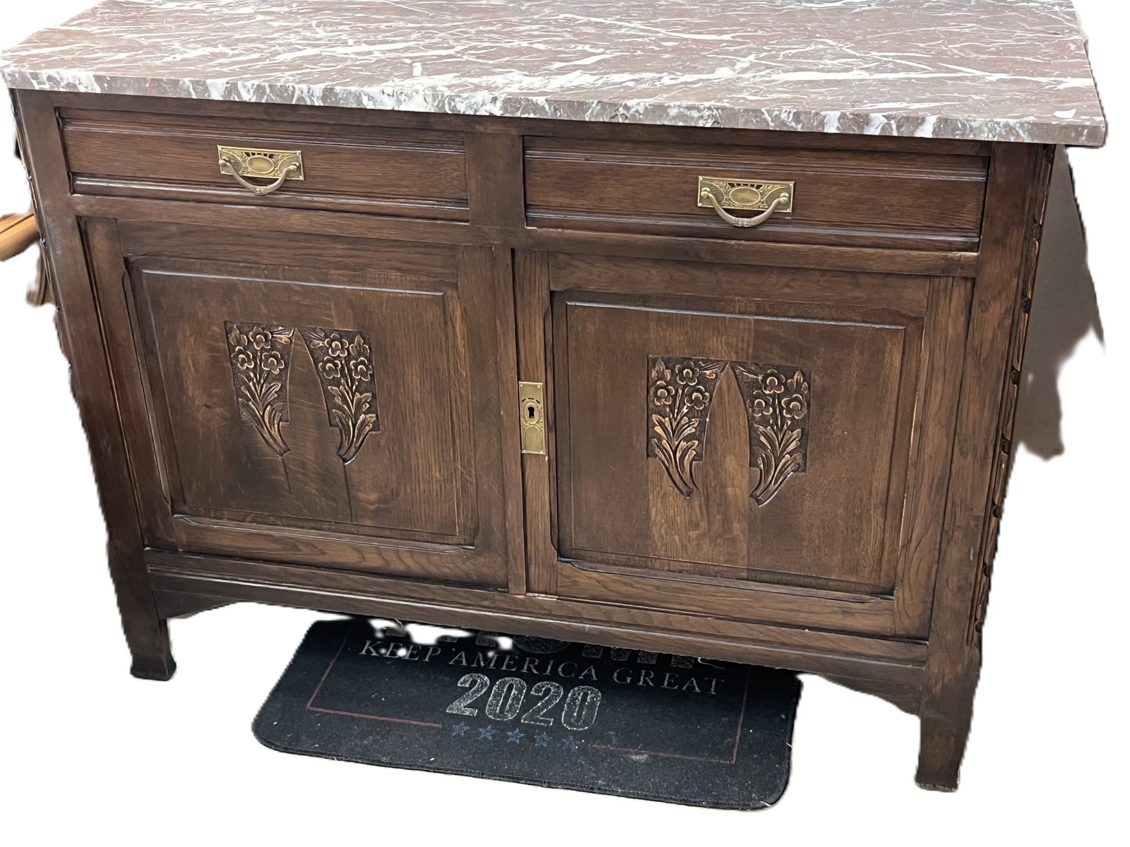 Vintage Marble Top Two-Drawer, Two-Door Buffet, 33Hx43Wx20D: Handsome vintage buffet featuring a brown marble top with white veining over a dark stained oak case. The front fitted with two drawers having brass bail handles and two paneled doors carved with styl