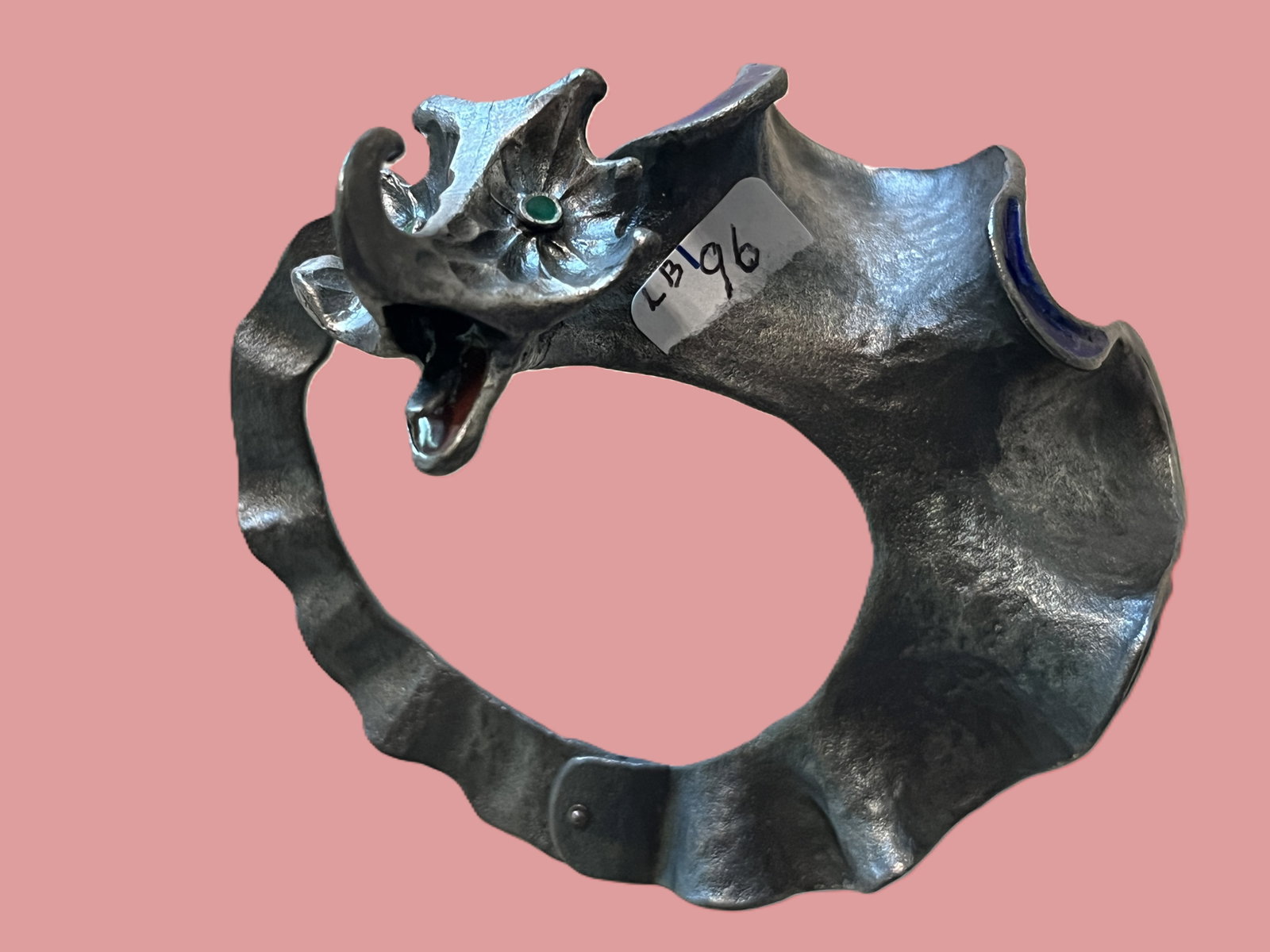 Vintage Custom Made Sculptural Metal Bracelet Dragon Motif with Inset Stones: A unique hand crafted sculptural bracelet formed from textured silver-tone metal, designed in a dramatic dragon or mythical creature motif. The piece features expressive detailing with an open mouth, 
