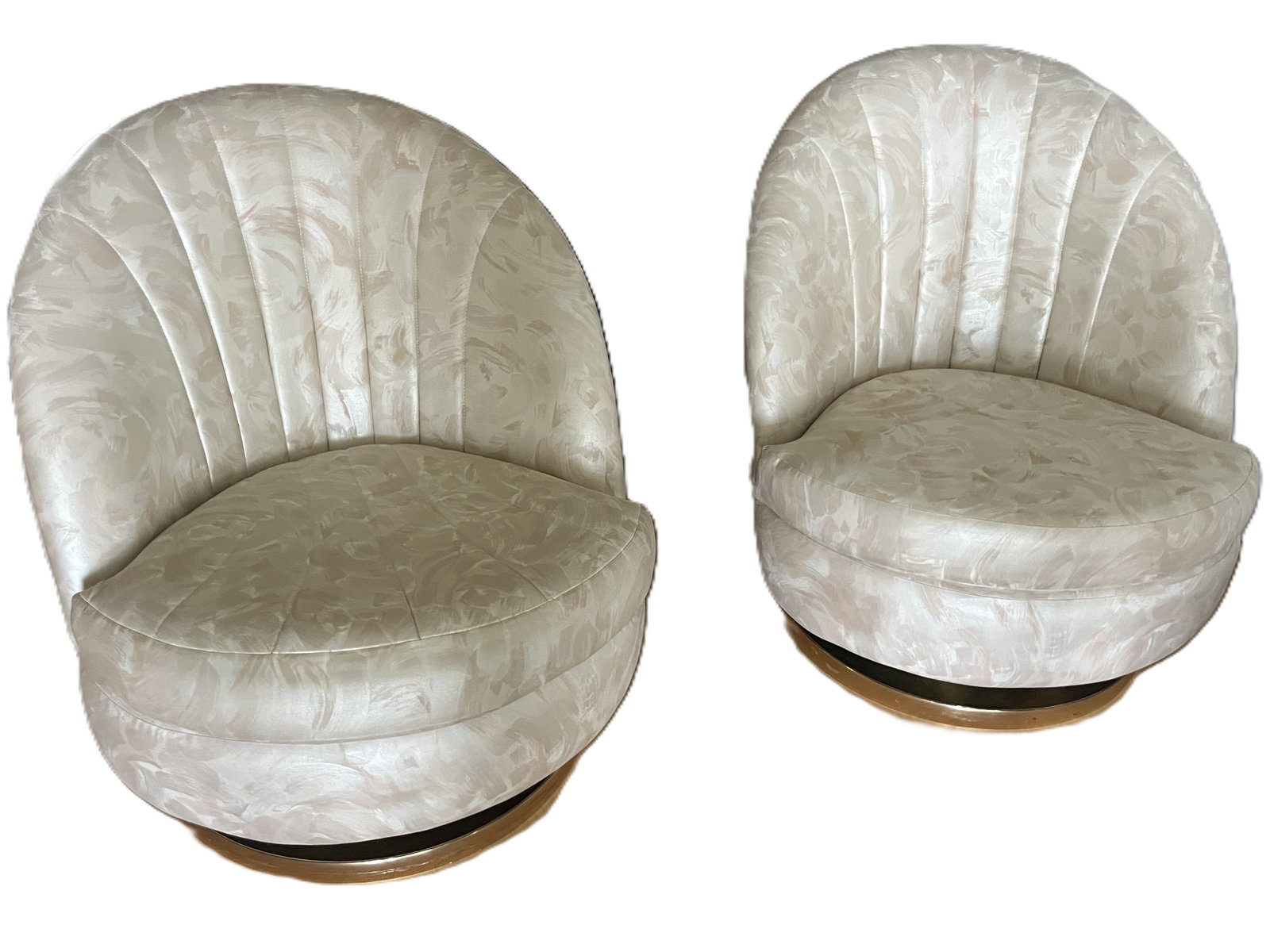 Pair of Thayer Coggin Vintage Swivel Lounge Chairs, Brass-Wrapped Bases: A striking pair of Thayer Coggin vintage swivel lounge chairs, each featuring a sculptural rounded shell back form with vertical channel tufting and plush cushioning. Upholstered in a soft cream fabri