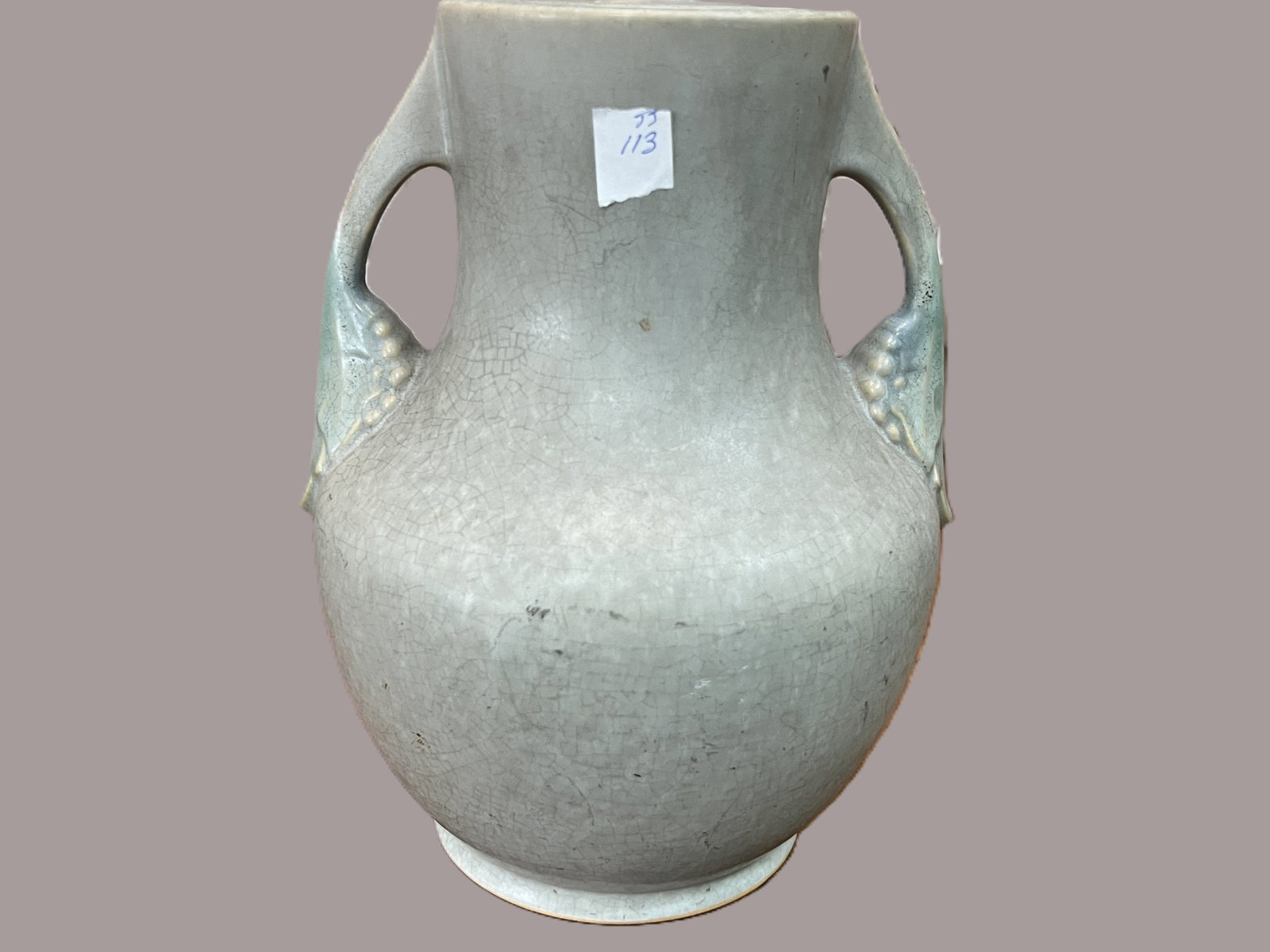 Possibly Roseville Arts & Crafts Two-Handled Crackle Glaze Vase, 9.5"H: Early 20th century American Art Pottery vase featuring a rounded body, short neck, and twin pierced handles, finished in a soft celadon gray crackle glaze with subtle blue green pooling at the shoulde
