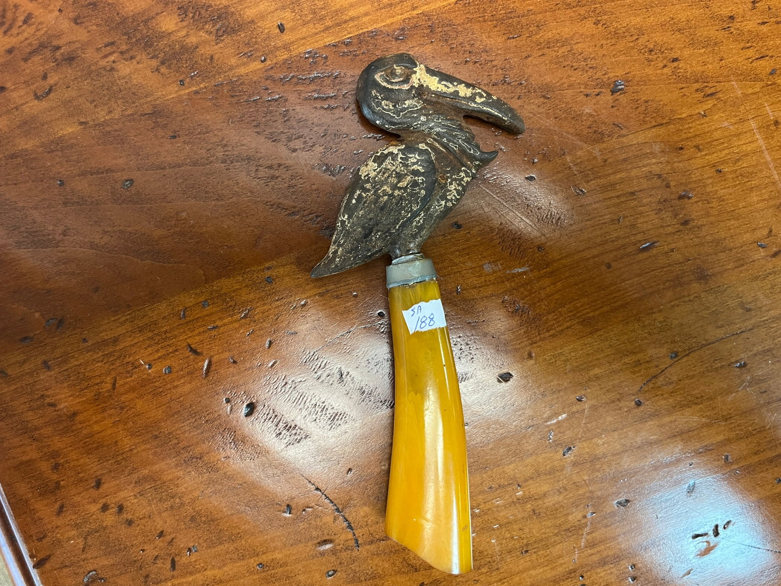 Mid-Cent. Figural Pelican Barware Bottle Opener with a Butterscotch Bakelite Handle c. 1930s-1950s, (1 of 4)