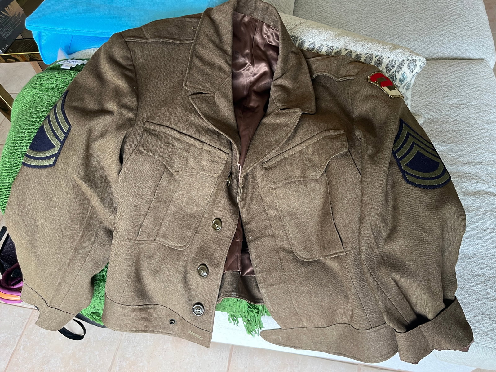 U.S. Army Master Sergeant Wool Ike Jacket, Army Forces Pacific Patch: Vintage U.S. Army olive drab wool Ike jacket featuring Master Sergeant (E-7) rank insignia on both sleeves and an Army Forces Pacific shoulder sleeve patch. Constructed with four front pockets, button