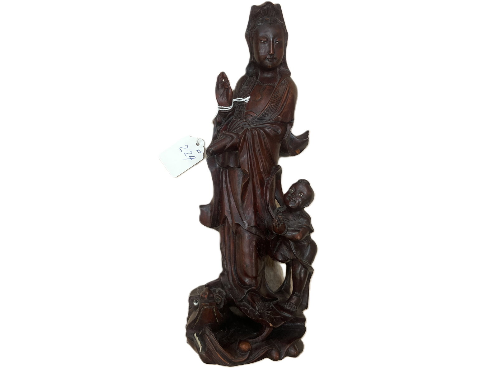 Chinese Carved Rosewood Guanyin with Child & Dragon/Fish, 12"H: Chinese carved rosewood figure of Guanyin (Kwan Yin), Bodhisattva of Compassion, depicted standing in flowing robes with one hand raised and accompanied by a child. The elaborately carved base incorpo