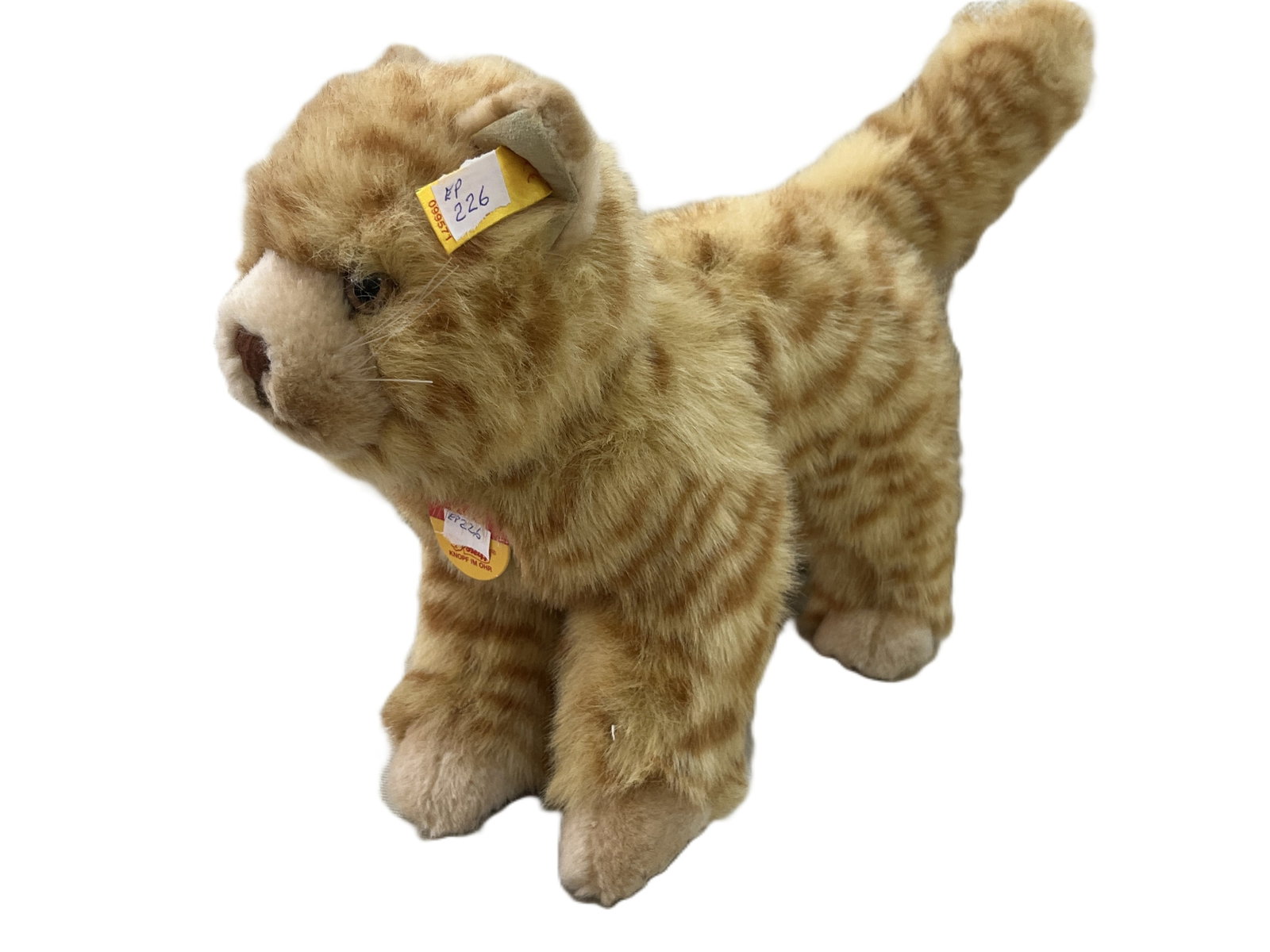 Vintage Steiff “Kitty” Mohair Tabby Cat w/ Button & Chest Tag, 8"H x 12"L x 5"W: Vintage Steiff “Kitty” cat plush figure featuring golden/tan mohair with darker tabby striping, cream muzzle and paws, glass-like eyes, embroidered brown nose, whiskers, upright tail, and a st