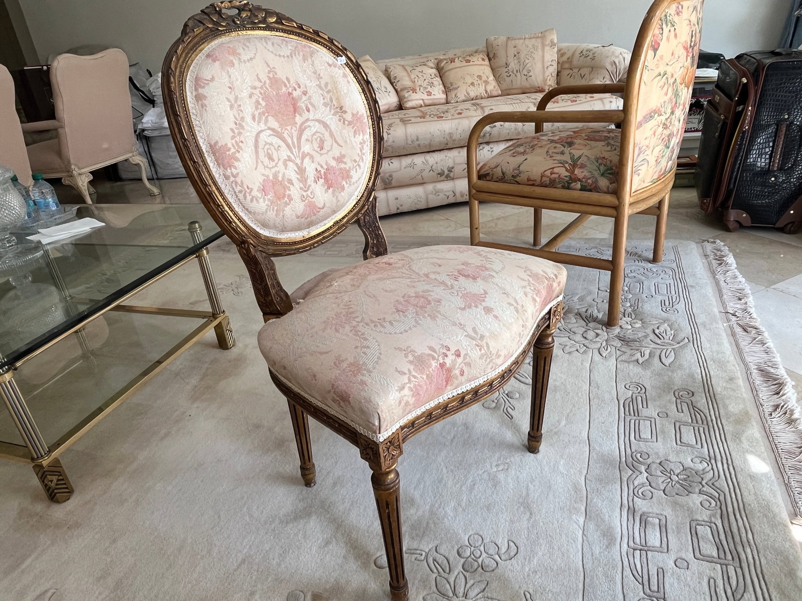 Louis XVI Style Giltwood Side Chair with Damask Upholstery, 20th Century, 36" H × 20" W × 20" D: A finely carved Louis XVI–style giltwood side chair featuring a rounded backrest and fluted legs. The frame displays acanthus leaf and ribbon motifs with aged gilt finish. Upholstered in a pale pink