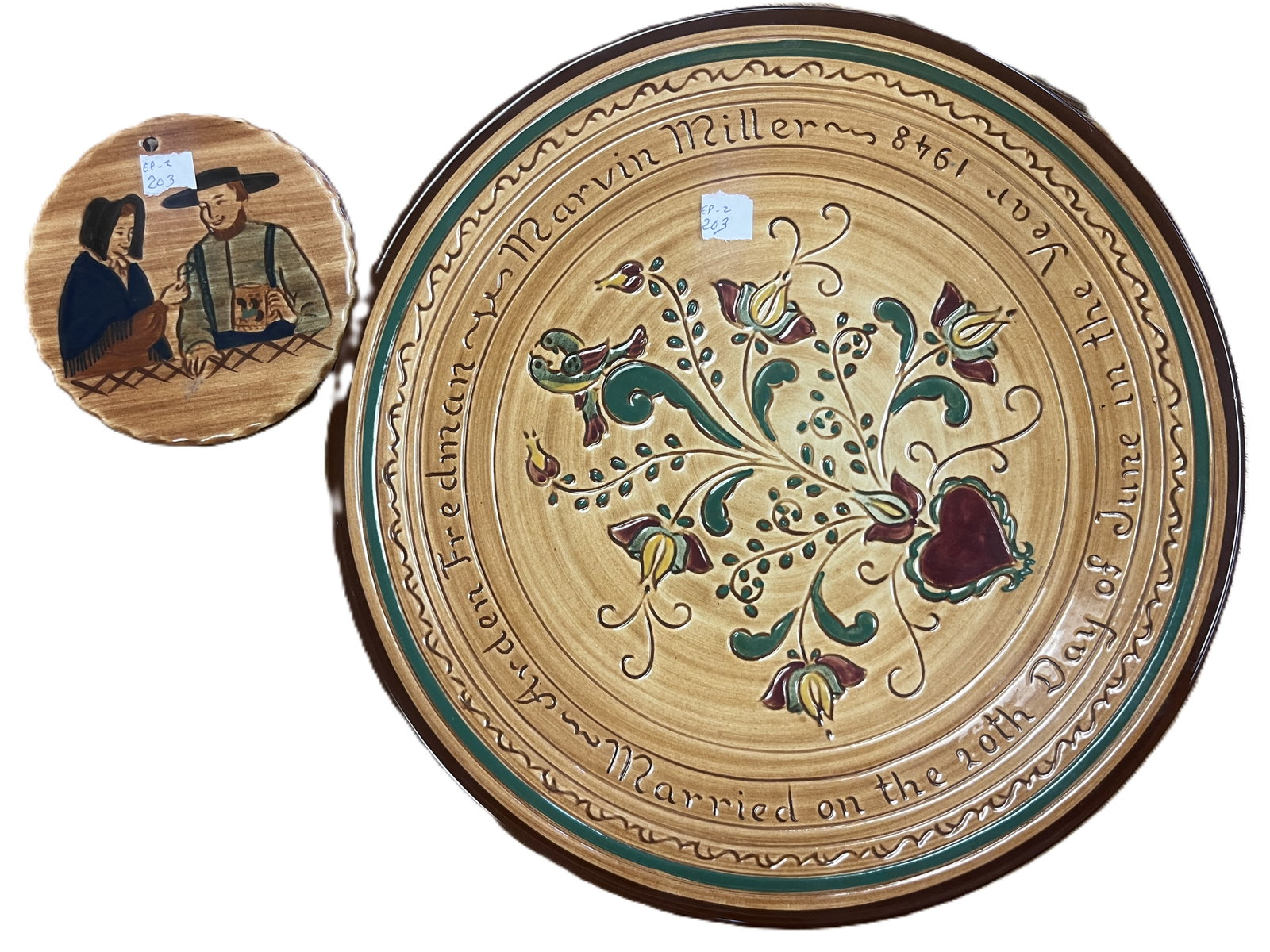 Pair of Pennsbury Pottery Pieces – Commemorative Plate 11.25" & Amish Couple Plaque 4.5": Two hand-decorated Pennsbury Pottery pieces, including a commemorative plate inscribed “Arden Freedman and Marvin Miller ~ Married on the 20th Day of June in the Year 1946” with stylized tulip