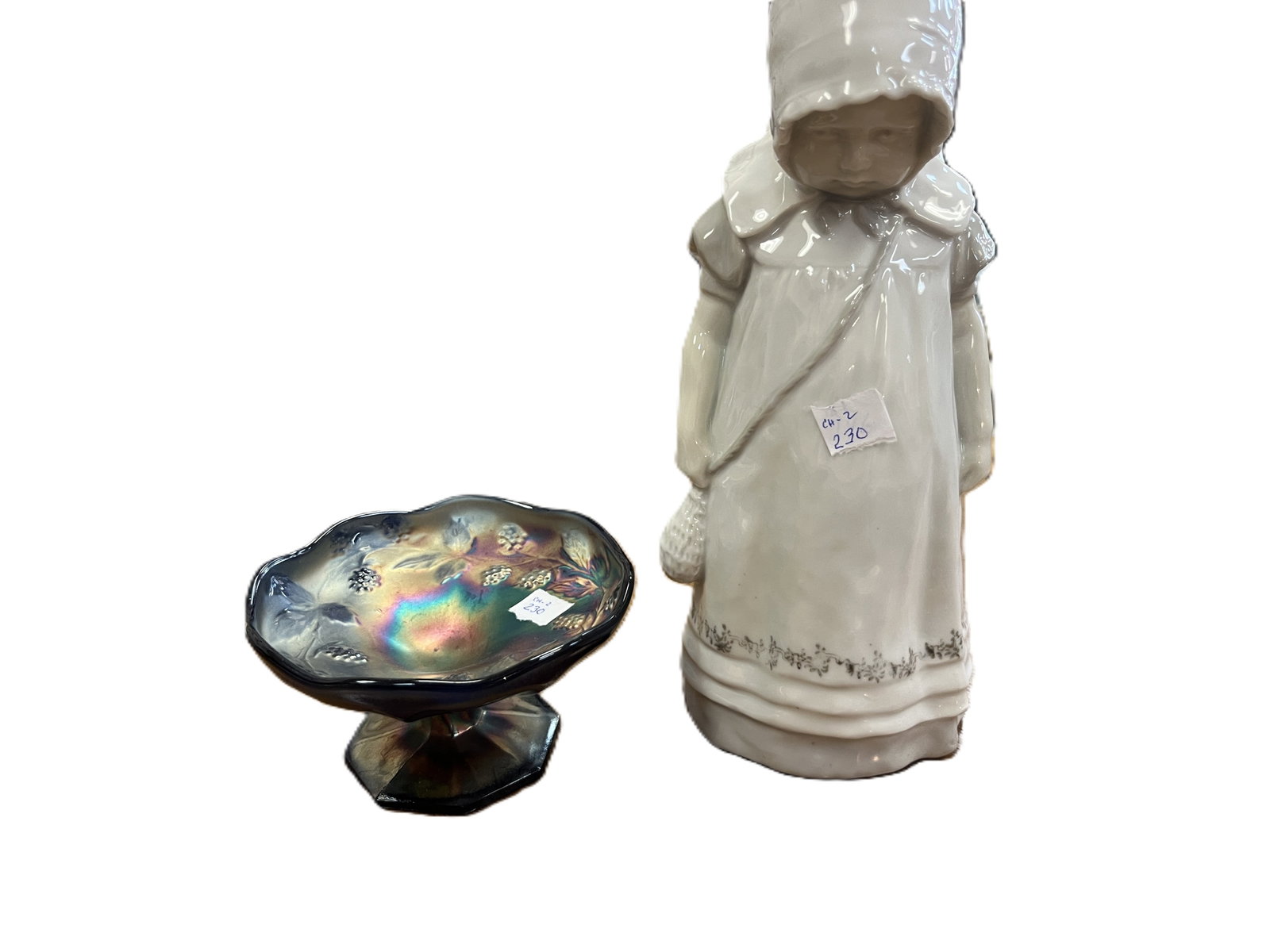 ROYAL COPENHAGEN PORCELAIN FIGURINE & NORTHWOOD CARNIVAL GLASS COMPOTE: Royal Copenhagen “Girl with Muff” #225, Denmark, early 20th century. Gloss glazed porcelain figure of a young girl in winter coat and bonnet, holding a muff. Marked with blue Royal Copenhagen 