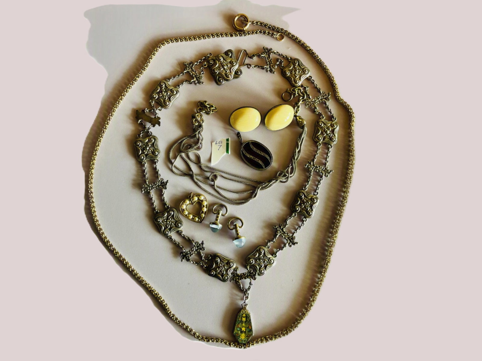 Bag Lot of Vintage Costume Jewelry: Assorted bag lot of vintage costume jewelry including an ornate silver-tone scrollwork link necklace with multicolor enamel drop pendant, long gold-tone textured chain necklace, silver-tone multi-stra