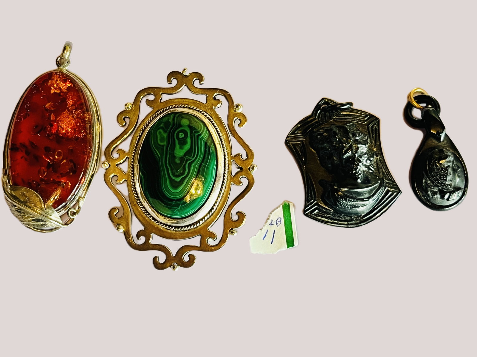 Vintage Costume Jewelry Bag Lot ? Mexican 925 Malachite, Amber-Style & African Pendants: Assorted vintage costume jewelry offered together as one bag lot. Includes an ornate Mexican silver brooch/pendant set with a large oval green banded malachite-style cabochon, with reverse markings ap