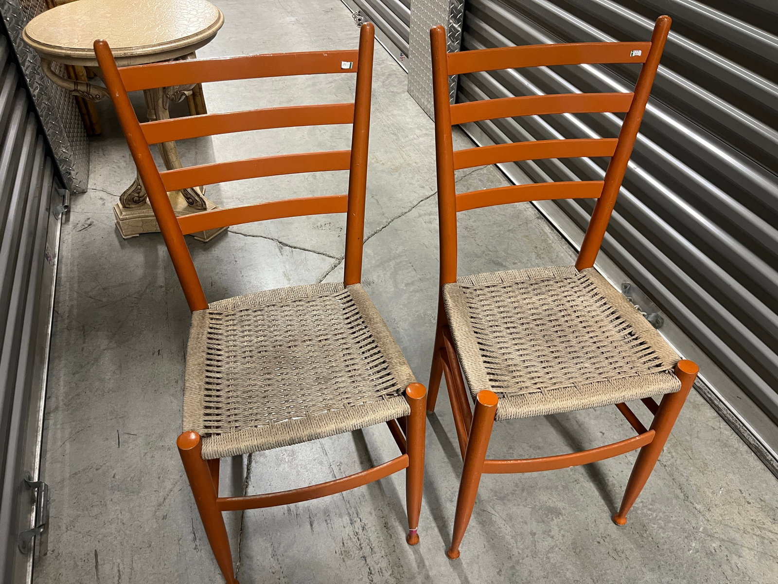 Pair Mid-Century Modern Ladder-Back Wood Chairs w/ Woven Cord Seats: Pair of vintage Mid-Century Modern / Scandinavian-style side or dining chairs featuring tall ladder backs, slender turned wood uprights, curved front stretchers and handwoven natural cord seats. Finis