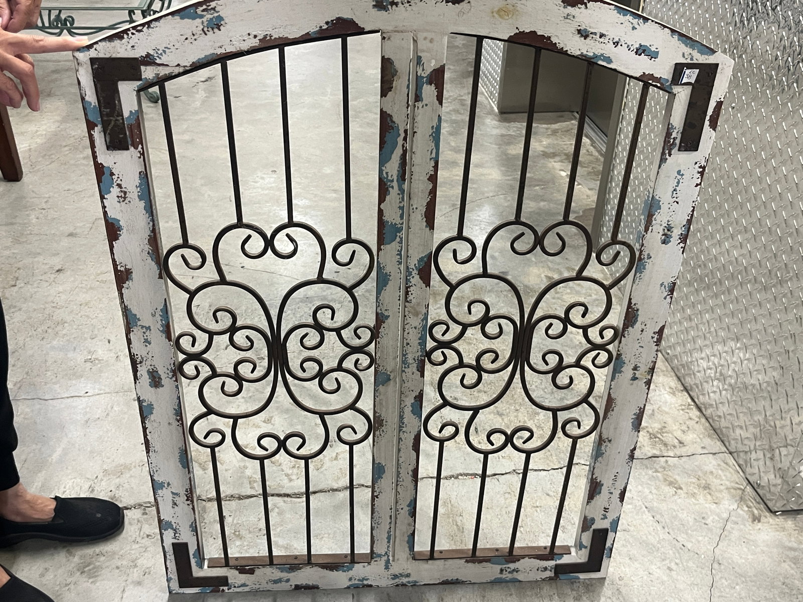 Distressed Wood & Wrought Iron Double-Door Wall Panel, 33" ? 29.5": Decorative architectural-style double-door wall panel constructed with a wood frame and inset dark metal scrollwork. Features an arched top, symmetrical ornamental ironwork, metal corner brackets and 