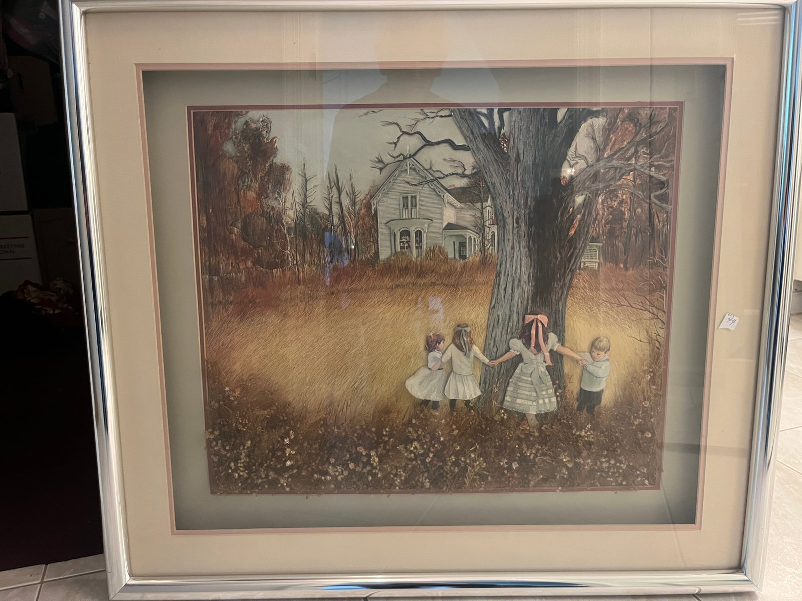 Vintage Mixed-Media Rural Americana Shadowbox Art w/ Dried Flowers, Chrome Frame, 30" x 34": Unusual vintage mixed-media dimensional artwork depicting four children gathered around a large tree in a rural country landscape with an old farmhouse in the background. The composition combines a pr