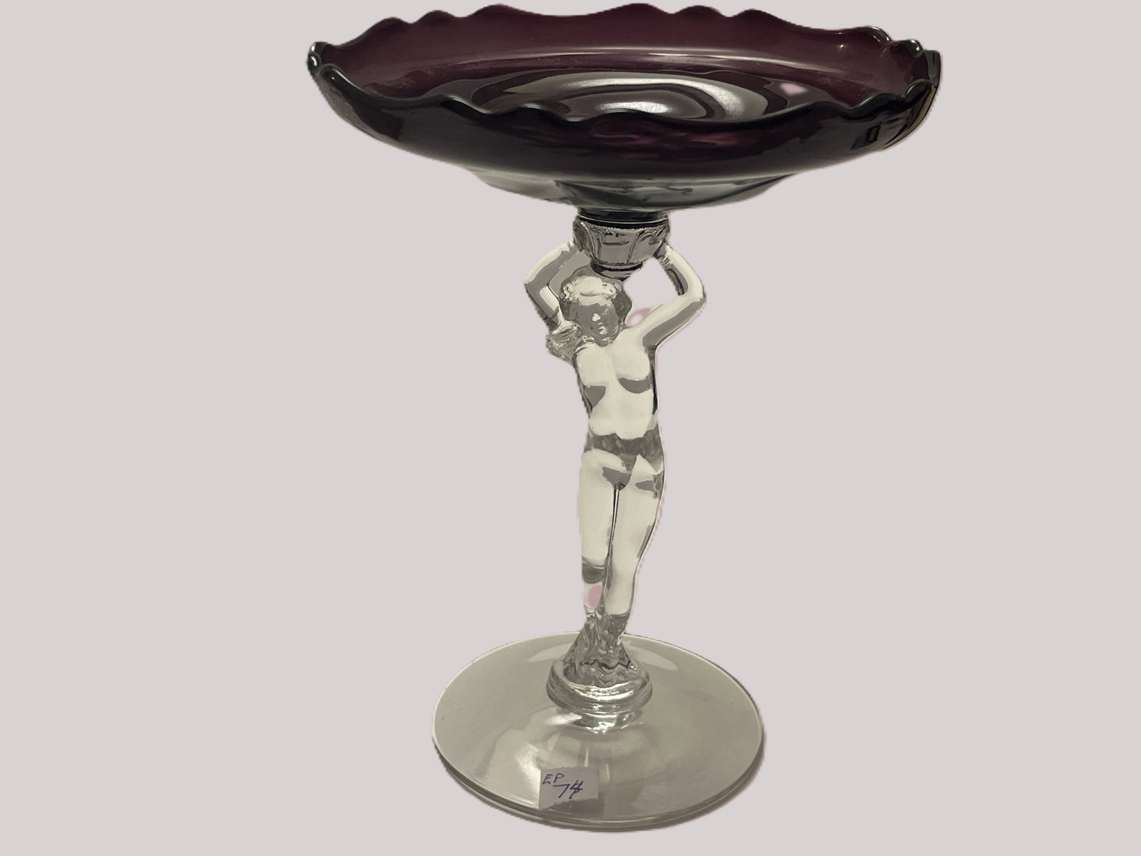Cambridge Glass #3011 Statuesque Nude Stem Amethyst Cupped Comport, 8.25"H: Vintage Cambridge Glass Company #3011 Statuesque (Nude Stem) comport, featuring a clear crystal nude female figure with raised arms supporting a rich Amethyst glass cupped bowl with gently flared, ruf