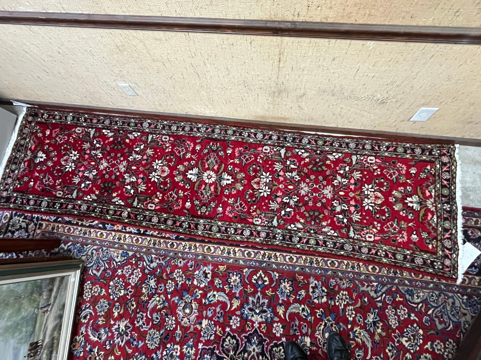 Vintage Pakistani Hand-Knotted Wool Runner Rug, Approx. 2'6" x 9'10": Vintage hand-knotted wool runner attributed to Pakistan, featuring a rich red field densely decorated with repeating floral and foliate motifs. The elongated field is framed by multiple narrow floral 