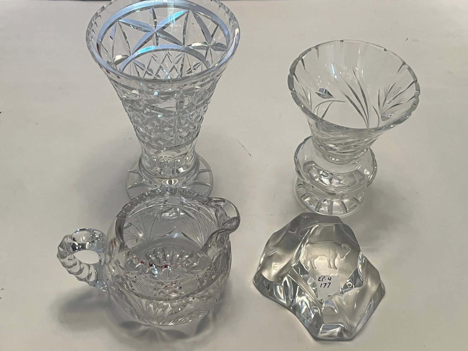 4-Pc Vintage Cut Crystal Decorative Lot ? Bison Paperweight, Basket & 2 Vases: Decorative four-piece clear crystal group featuring a variety of traditional cut and etched designs. Includes a heavily cut flared vase with geometric diamond and star cutting; a smaller flared vase w