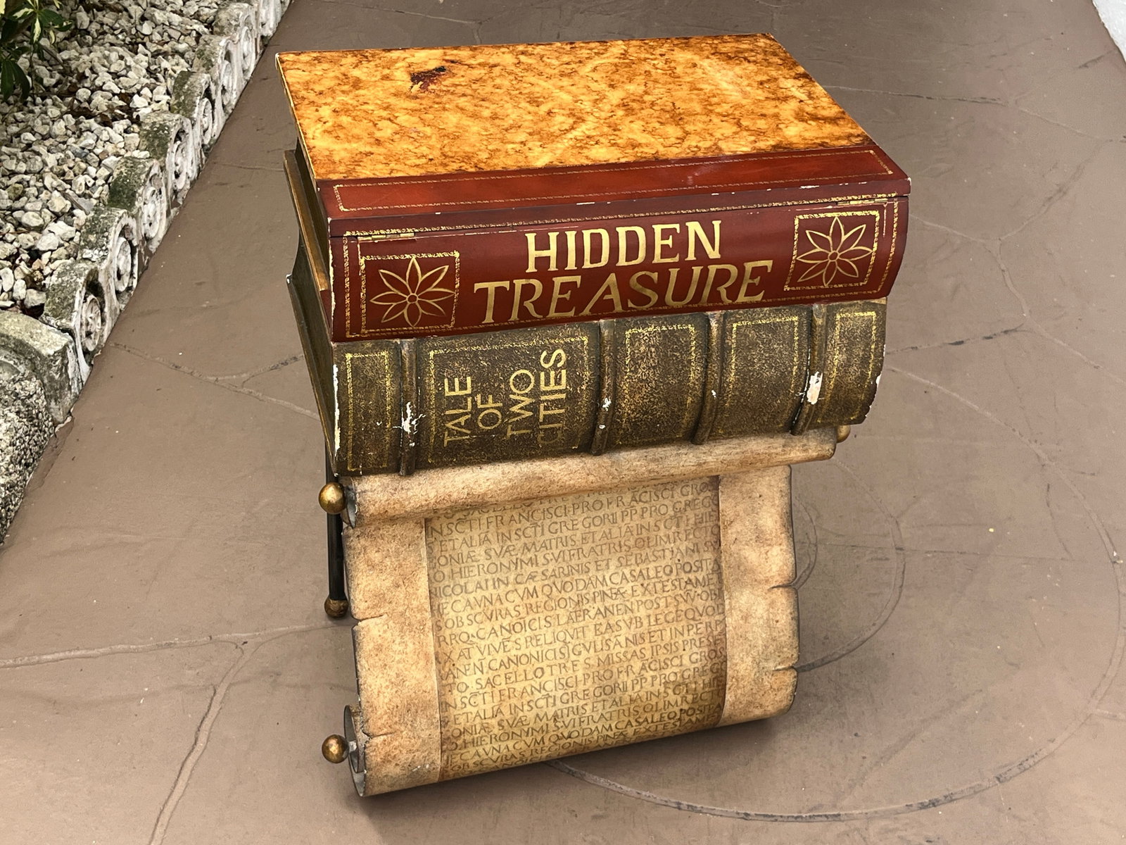 Novelty Stacked Book ?Hidden Treasure? Latin Scroll Storage Accent Table, 24" H x 18" W x 15" D: Unusual decorative stacked-book accent table with concealed storage, measuring approximately 24" H x 18" W x 15" D. Designed to resemble oversized antique books, including volumes titled ?Hidden Treas