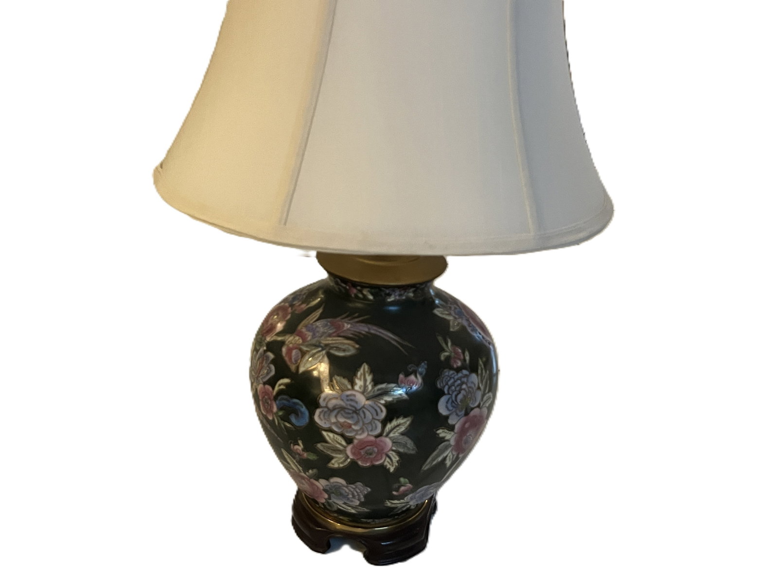 26" Asian-Style Black Porcelain Floral Table Lamp on Wood Base: Decorative Asian-style porcelain table lamp featuring a rounded black-glazed body richly decorated with multicolor floral and bird motifs in shades of pink, blue, green and gold. The porcelain body is