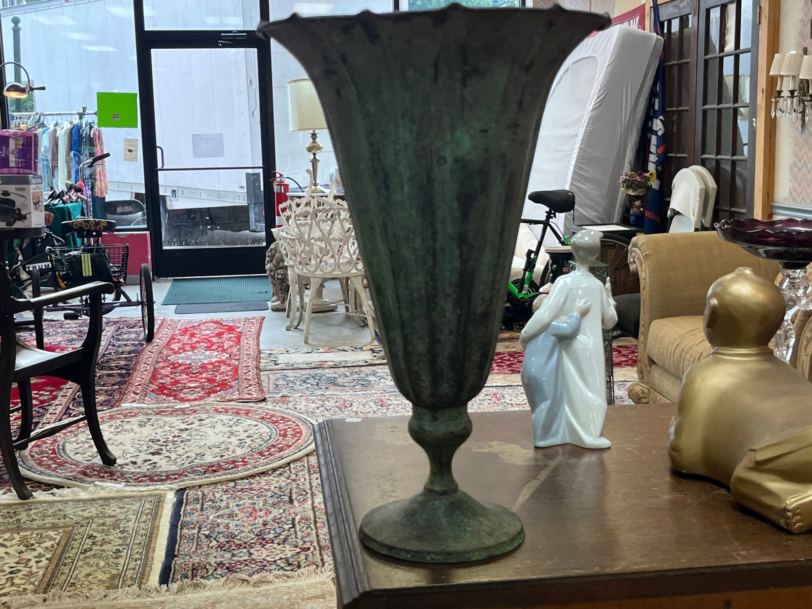 Vintage Patinated Copper/Metal Fluted Trumpet Vase – 15"H: Vintage decorative fluted trumpet-form vase or urn, measuring approximately 15" high. Features a tall tapered body with deeply ribbed/fluted sides, dramatically flared scalloped rim, turned stem and r