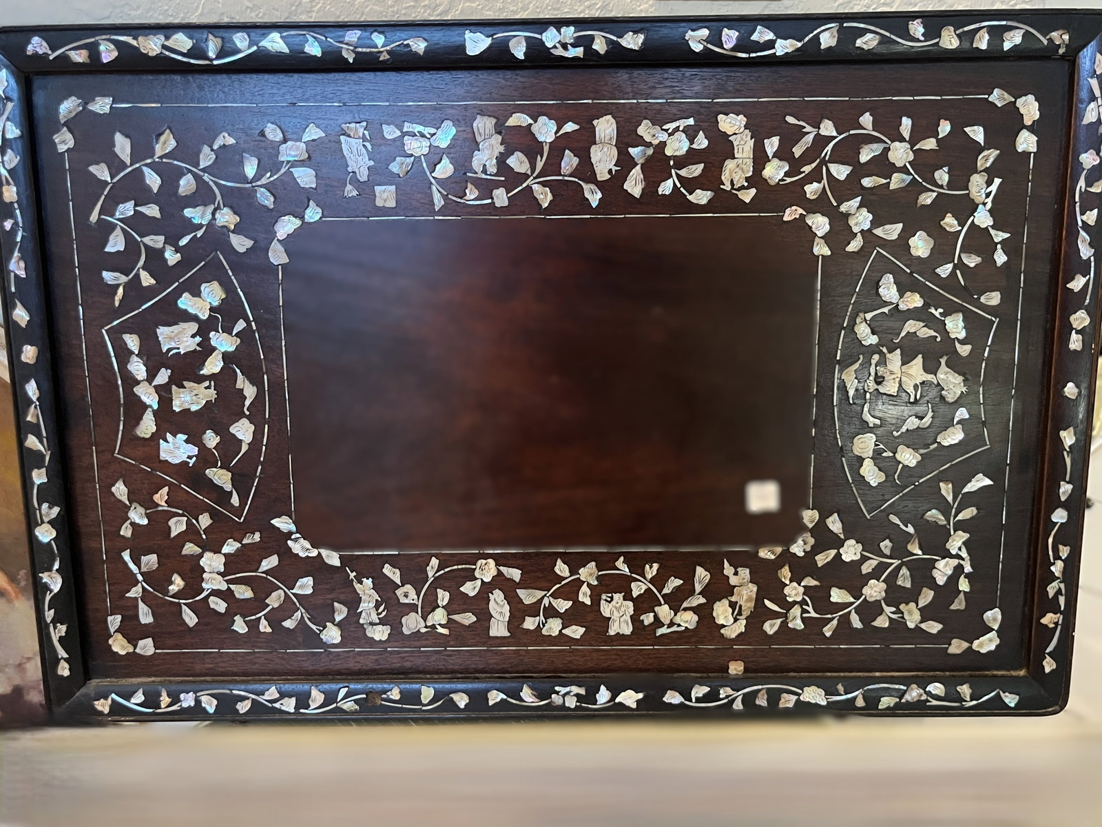 Asian Mother-of-Pearl Inlaid Dark Hardwood Tray, 16.25" x 25": Decorative Asian dark hardwood serving or display tray extensively embellished with hand-cut mother-of-pearl inlay. The wide border is decorated with scrolling flowering vines interspersed with figura