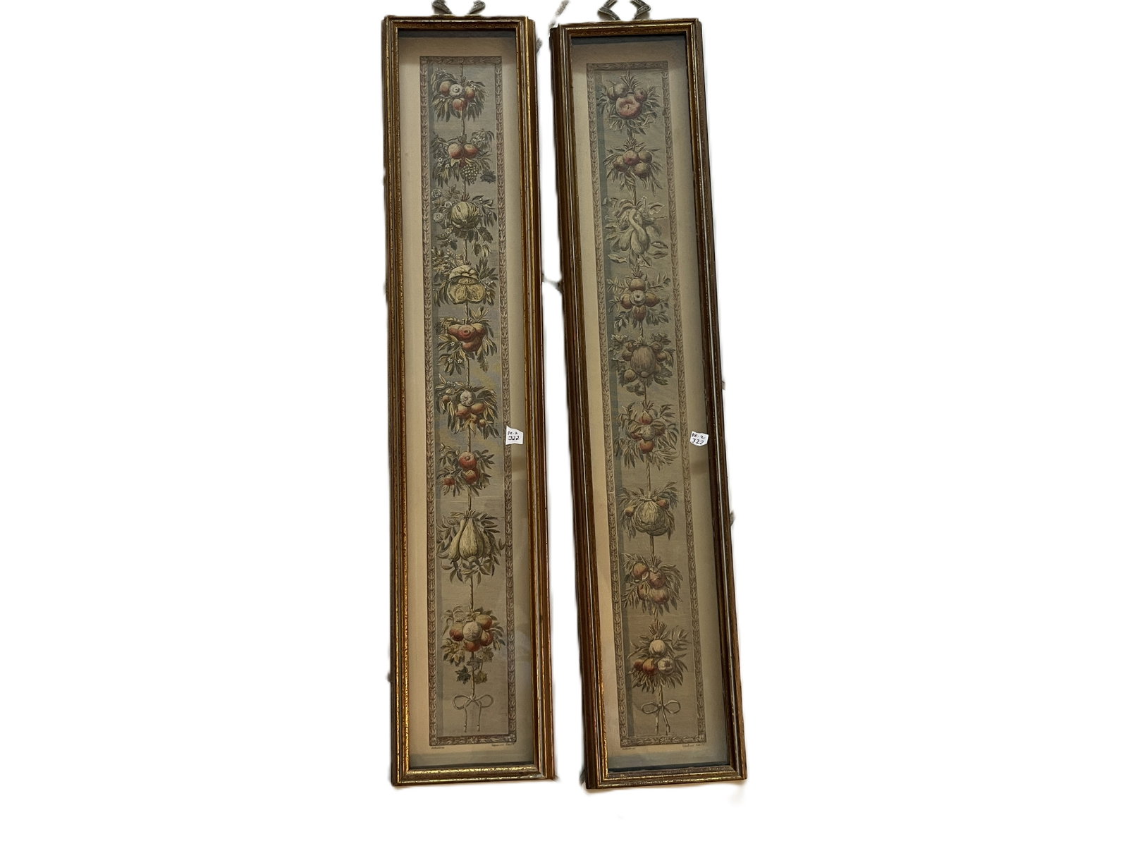 Pair VTG Framed Botanical Fruit Prints, 31" x 6" Each: Attractive pair of long, narrow classical-style botanical fruit prints, each featuring a vertical arrangement of assorted fruits, foliage and blossoms tied with a ribbon at the bottom. The muted color