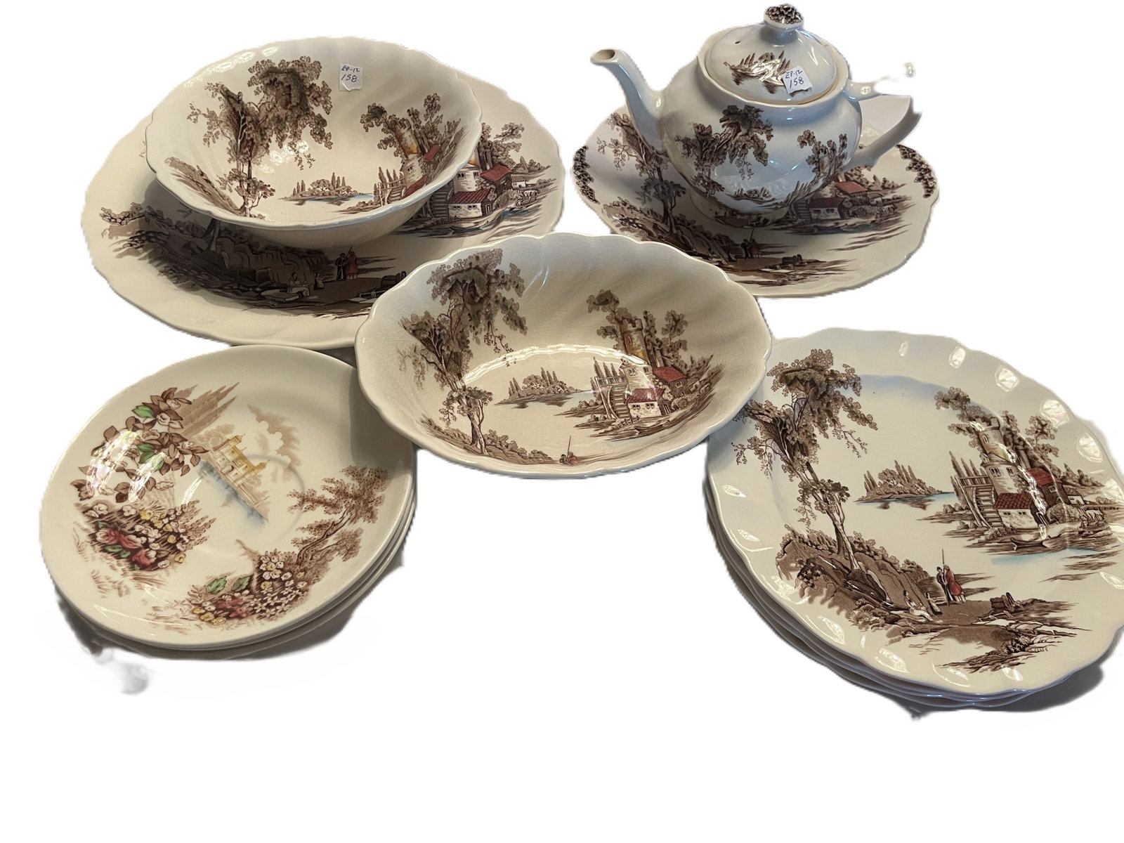 12-Pc Johnson Bros. “Castle on the Lake” English Transferware Serving Set, England: Vintage 12-piece Johnson Brothers “Castle on the Lake” English transferware collection, decorated with a picturesque lakeside castle/mill landscape in brown with touches of red, blue and green