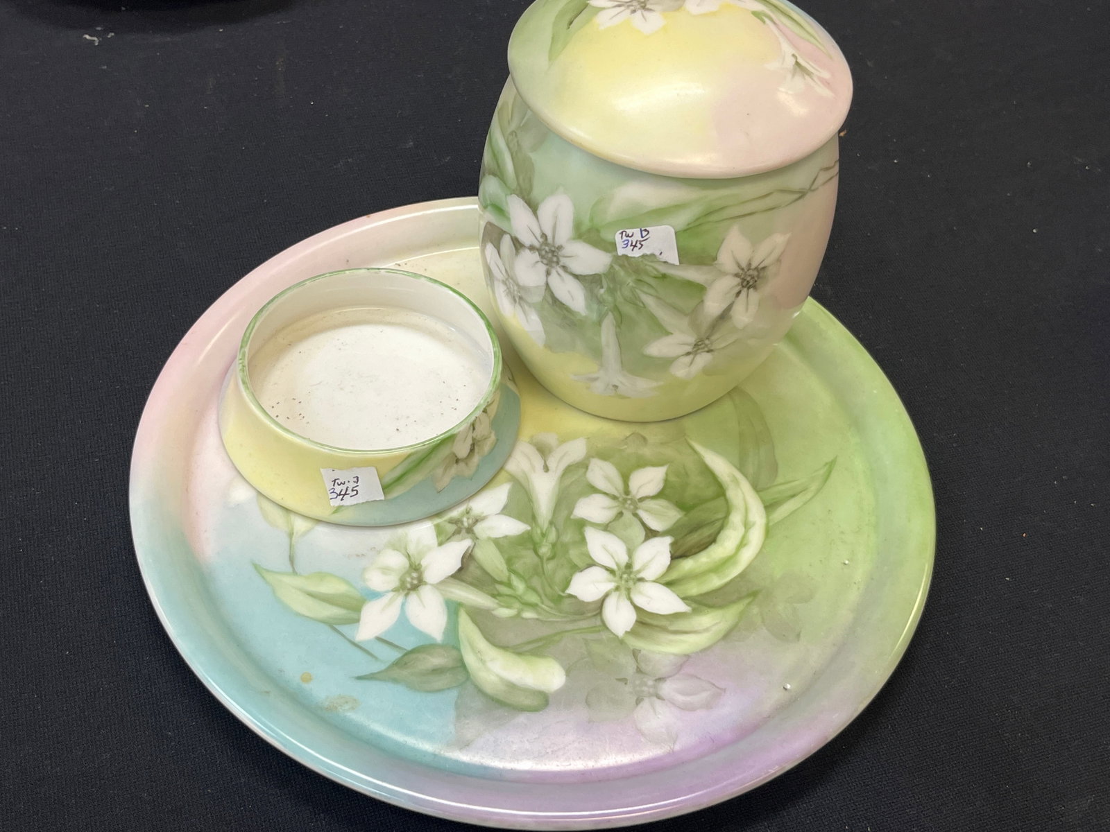 VTG Limoges France Hand-Painted Floral Porcelain Humidor 3-Pc. Smoking Set: Vintage Limoges, France porcelain three-piece smoking set featuring a coordinated hand-painted floral decoration in soft pastel shades of green, yellow, pink and blue with white blossoms and foliage. 