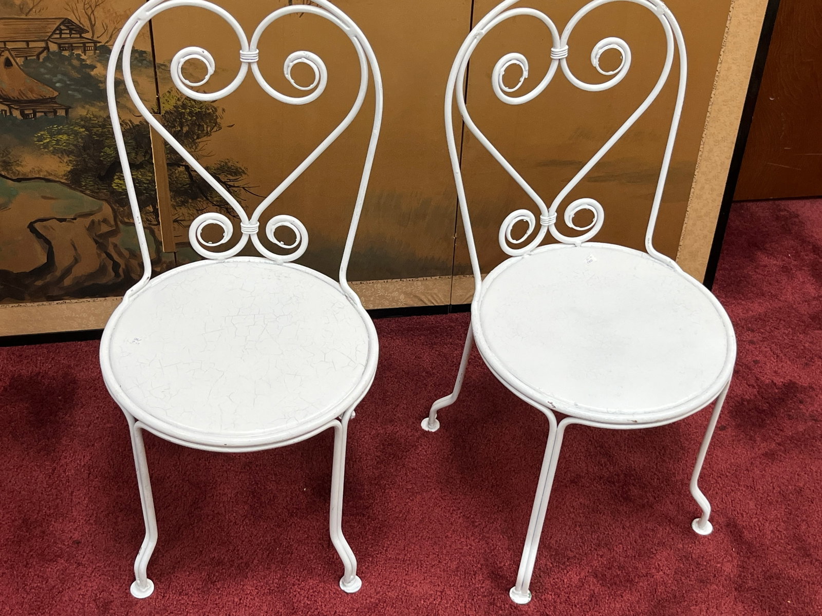 Pair VTG White Painted Metal Child?s Garden Chairs ? 26.5" H: Charming pair of vintage child-size metal chairs featuring decorative heart-shaped scrolling backs and round solid metal seats. Finished in white paint with curled scrollwork and slender legs ending i