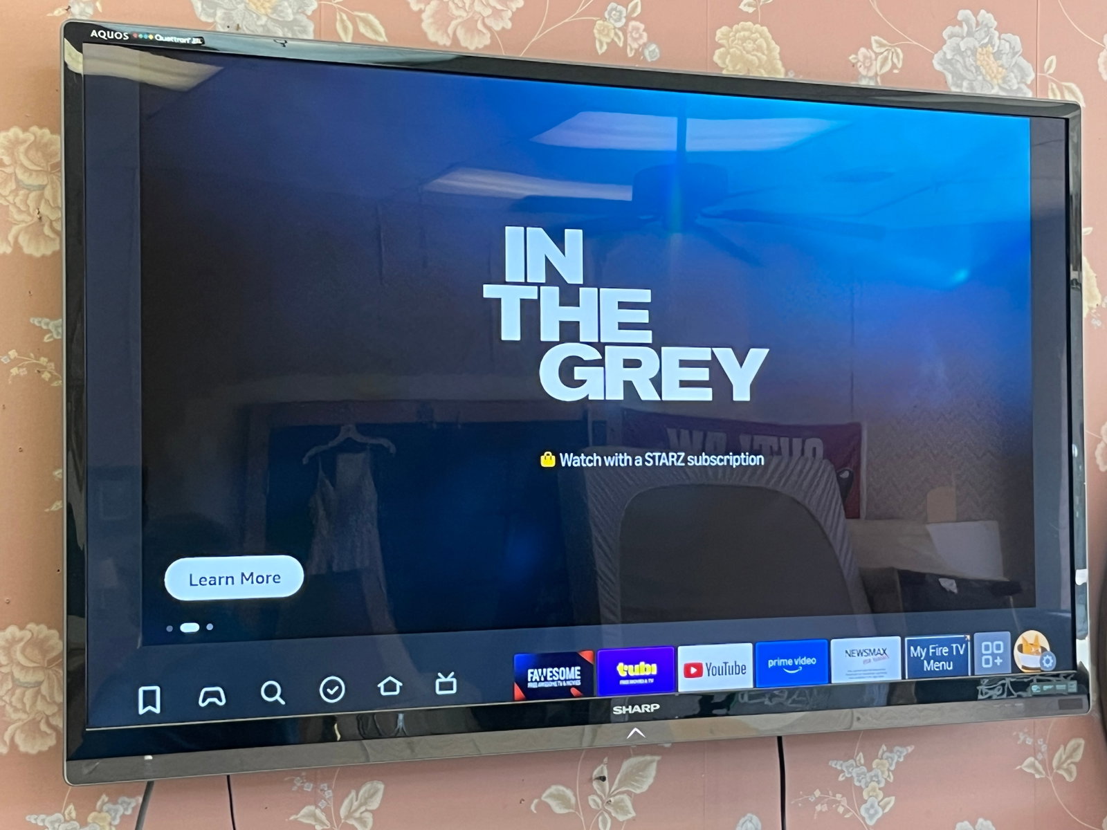 Sharp AQUOS 60" LED Flat Screen HDTV ? Wall Mounted, Working: Sharp AQUOS 60-inch flat screen television, shown powered on and operating. Large-format HDTV with slim black bezel, suitable for living room, media room or commercial use. Currently wall mounted and 