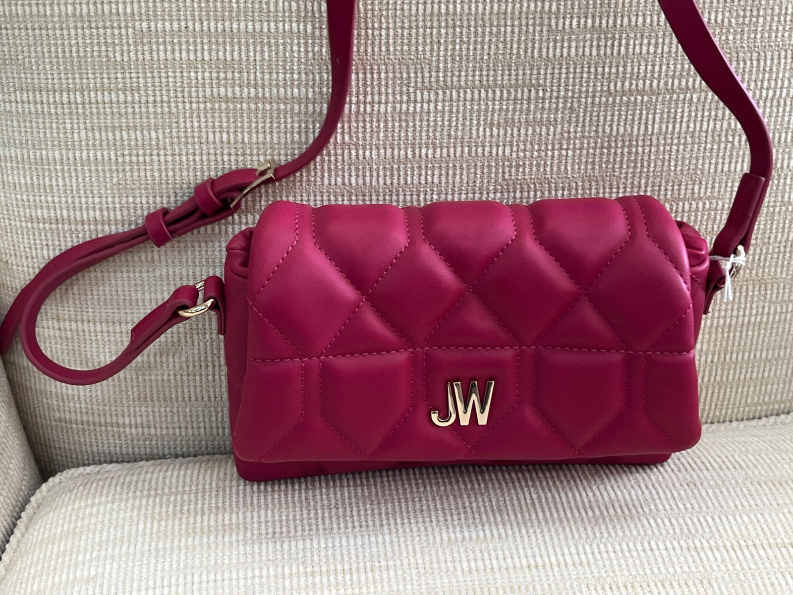 Jason Wu Quilted Fuchsia Pink Crossbody Handbag with Gold-Tone JW Logo: Stylish Jason Wu crossbody handbag in a rich fuchsia/magenta pink color. Features a padded diamond-quilted flap, gold-tone JW logo hardware, adjustable shoulder/crossbody strap and coordinating gold-t