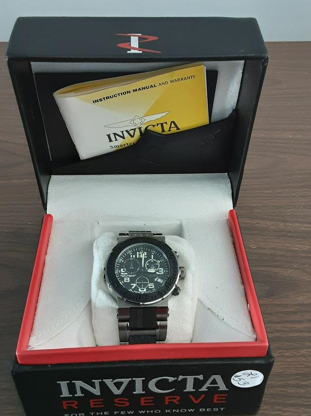 Mens Invicta Reserve model wrist watch: Great Mens Invicta Reserve model wrist watch. This watch is in great condition in the original box. A fantastic chronograph watch. The watch measures approximately 46 millimeters and has extra links .
