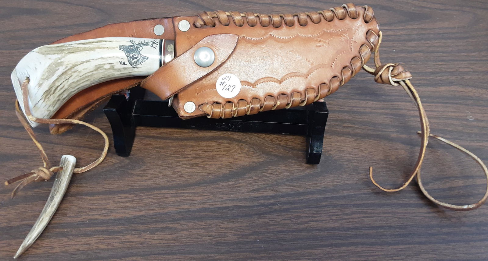 Handmade vintage side knife: Handmade vintage side knife. This knife features a very nice genuine antler handle with an elk. A nice leather sheath. Note signed KR on the handle. Measures 11 1/2 inches overall.