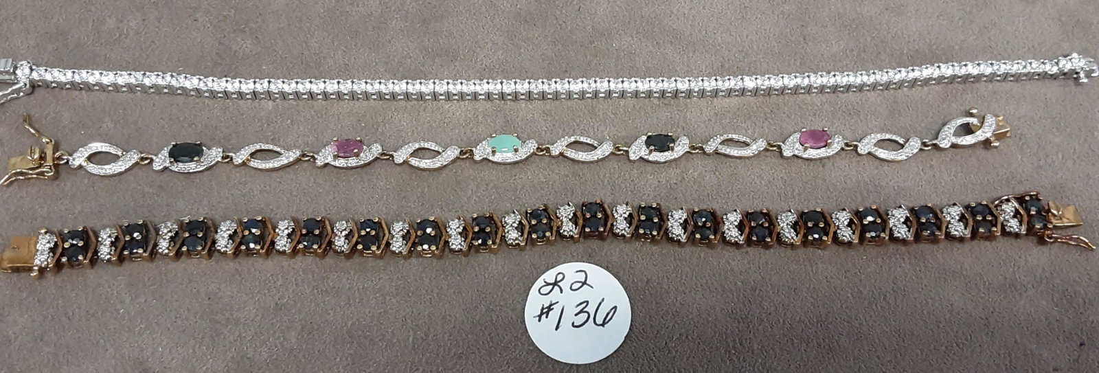 Three stunning Sterling silver bracelets: Three stunning Sterling silver bracelets. You are bidding on three beautiful bracelets including a 10 karat genuine sapphire bracelet, a multi gemstone 5 carat sapphire Ruby and emerald bracelet, and 