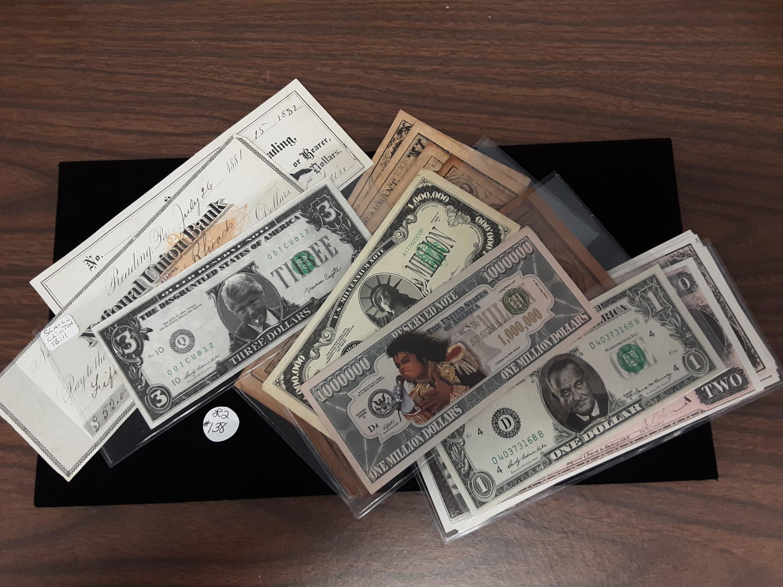 An interesting lot of paper money and paper: An interesting lot of paper money and paper. All for one money. Including 1882 checks, LBJ $1 bill, Bill Clinton $3 bill and much much more.