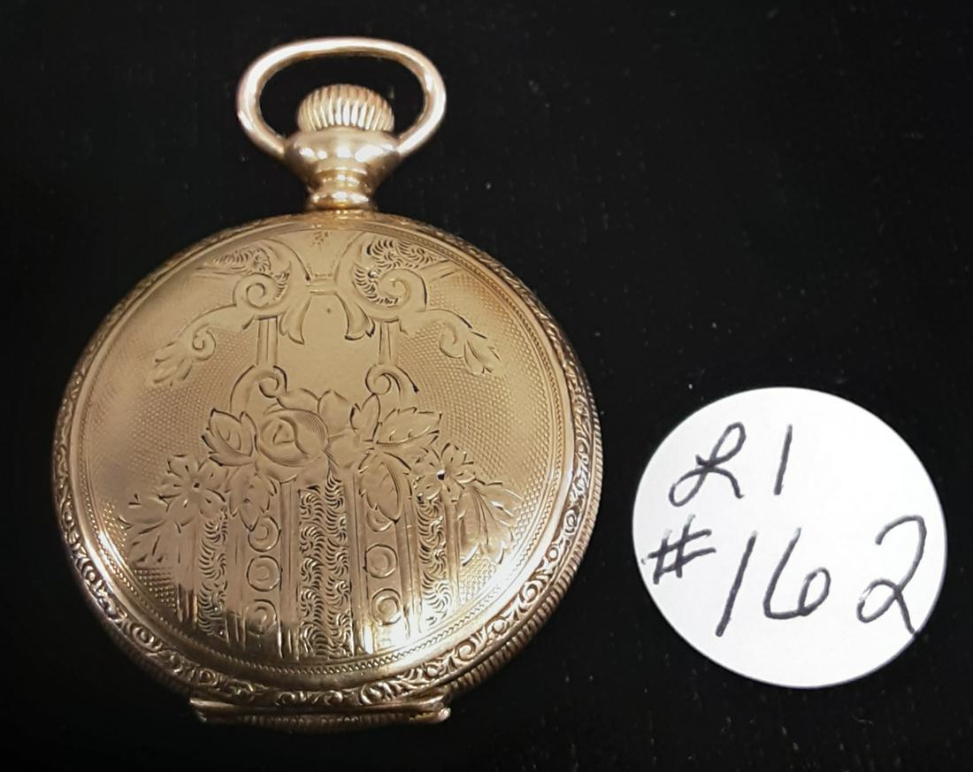 Ladies gold beautifully engraved pendant watch by: Ladies gold beautifully engraved pendant watch by Hampden watch company. The Molly stark model. Sold as is.