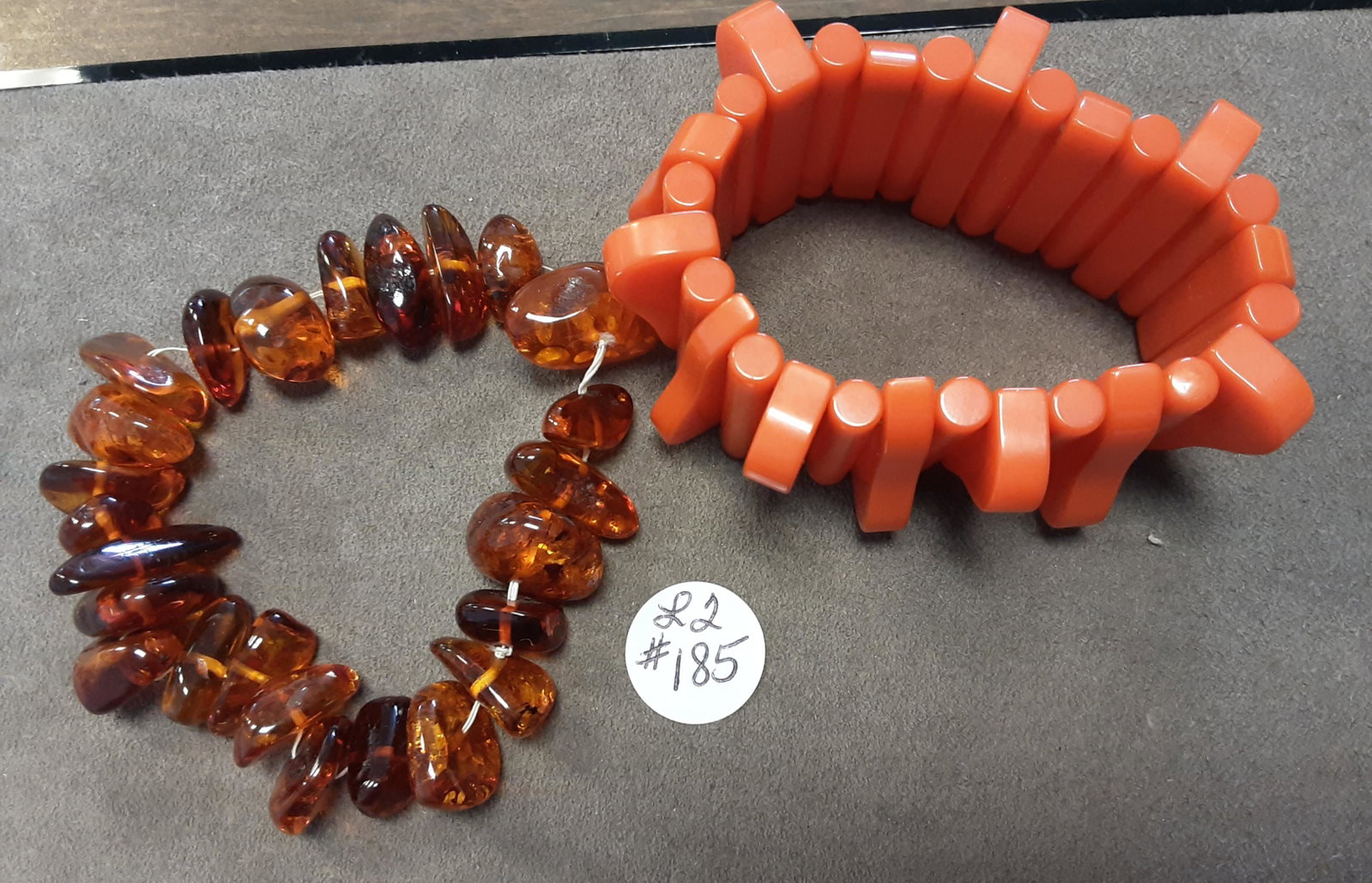 A scarce grouping of vintage jewelry: A scarce grouping of vintage jewelry. You are bidding on a rare orange color Bakelite bracelet, and a genuine Amber bracelet. Sold as a lot. All for one money.