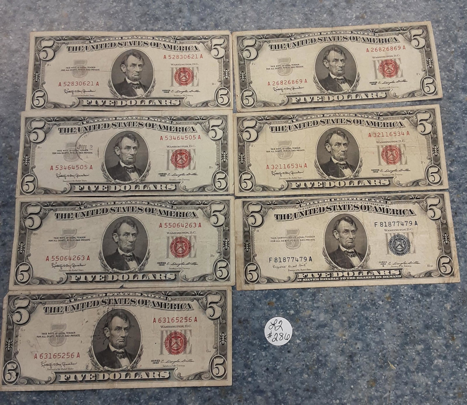 Collection of red and blue seal US $5 bills: Collection of red and blue seal US $5 bills. 7 in all. $35 face value.